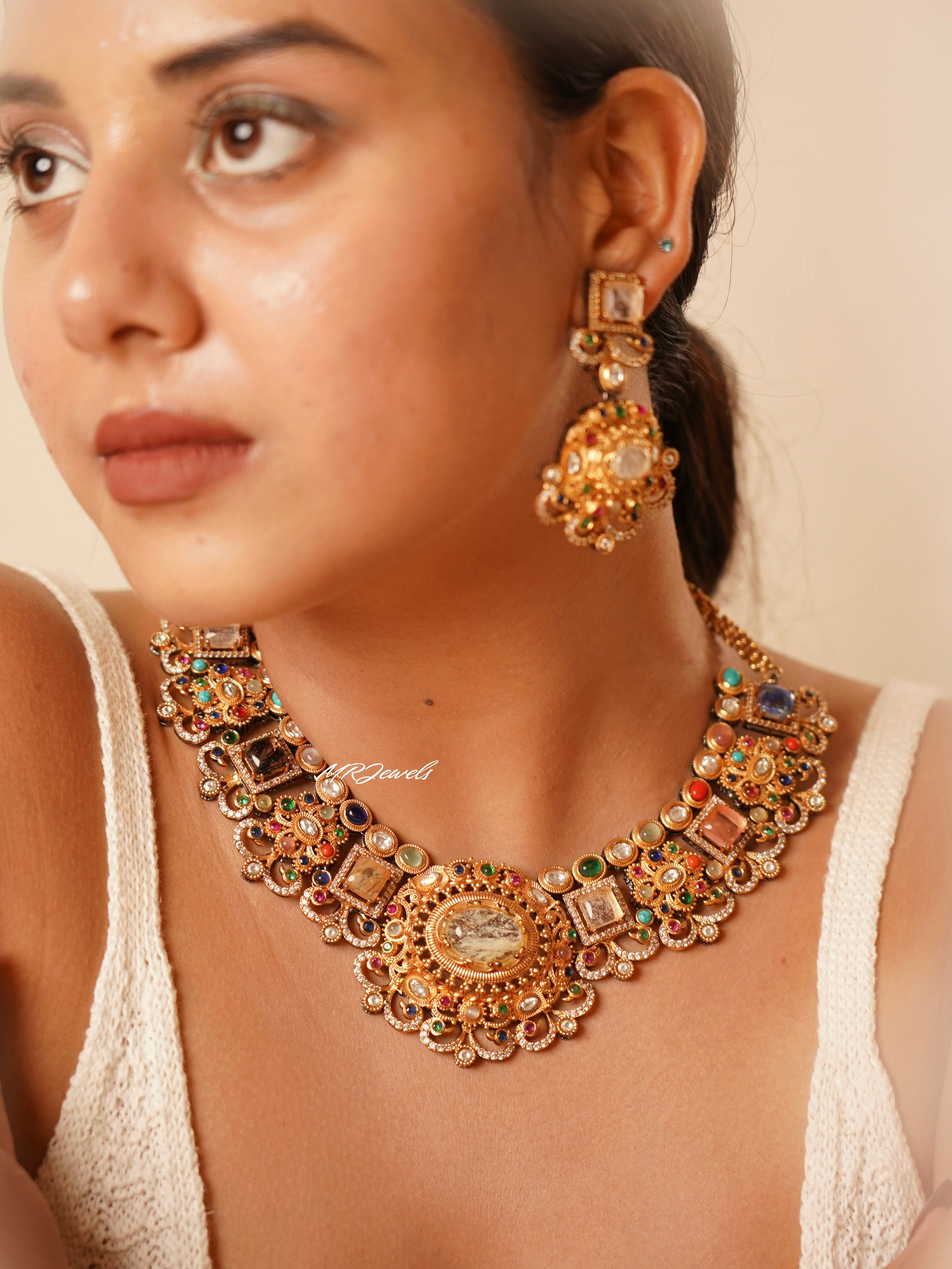 Artisan necklace set with pearls and bold stones in gold motifs, Sabyasachi-inspired design