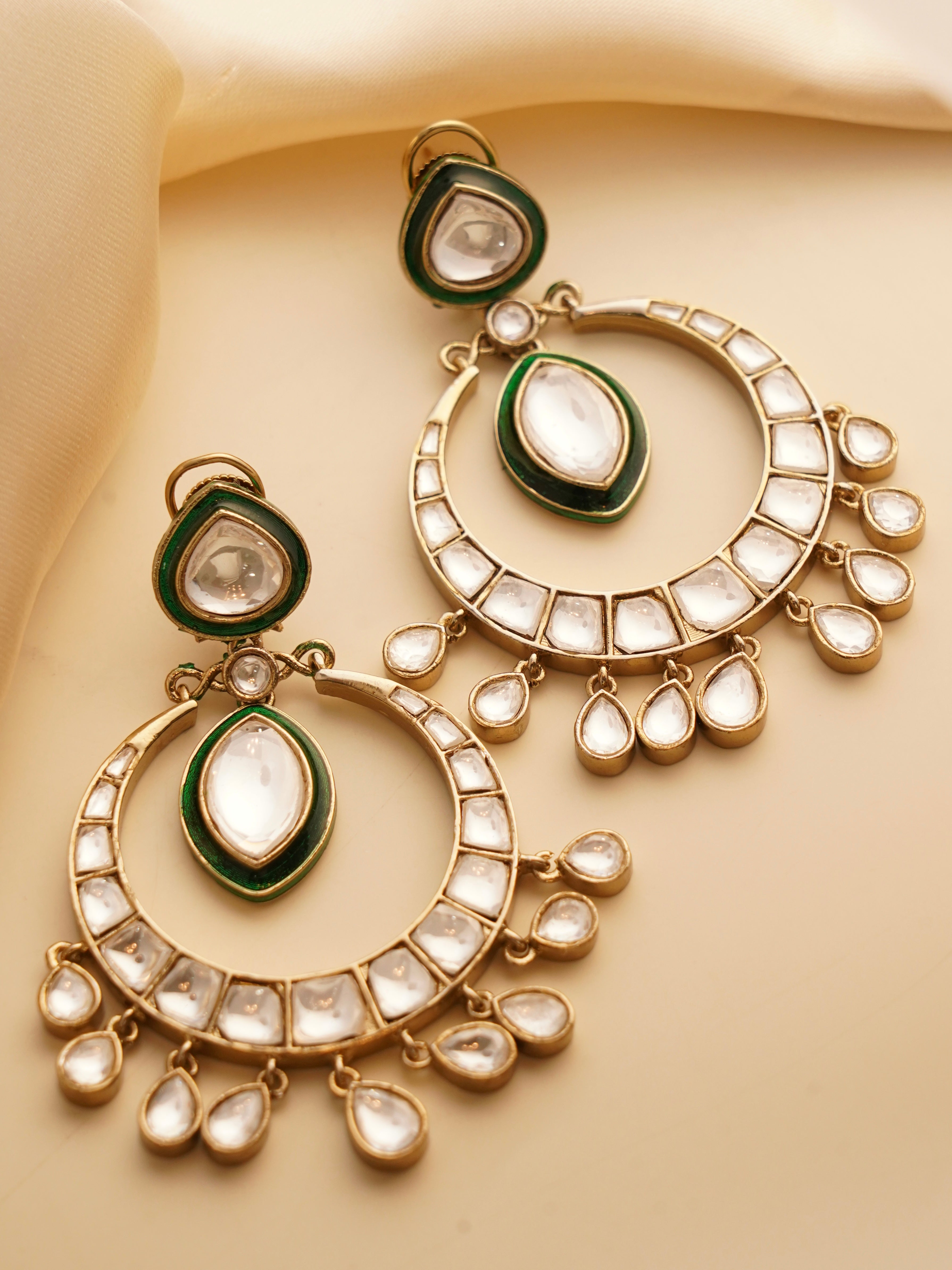 Side view of Alia-style kundan earrings with intricate enamel work and classic chaand silhouette