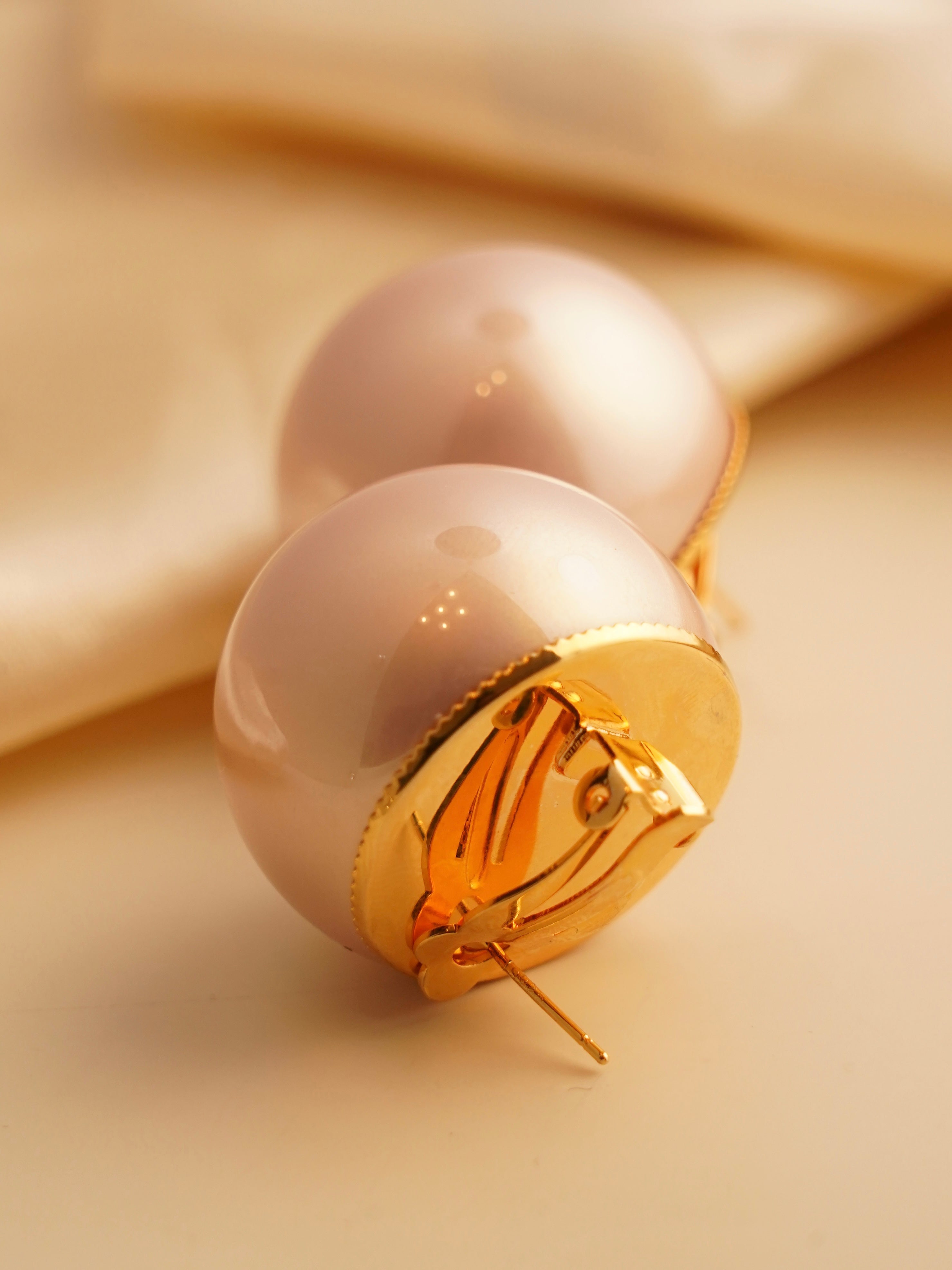 Oversized pearl stud earrings, 30mm, front view with glossy finish