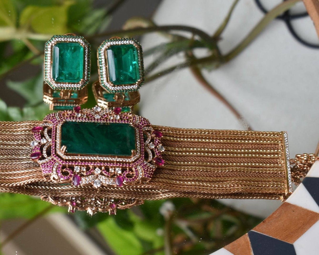 Detailed rear view of emerald choker necklace clasp and stone finishing