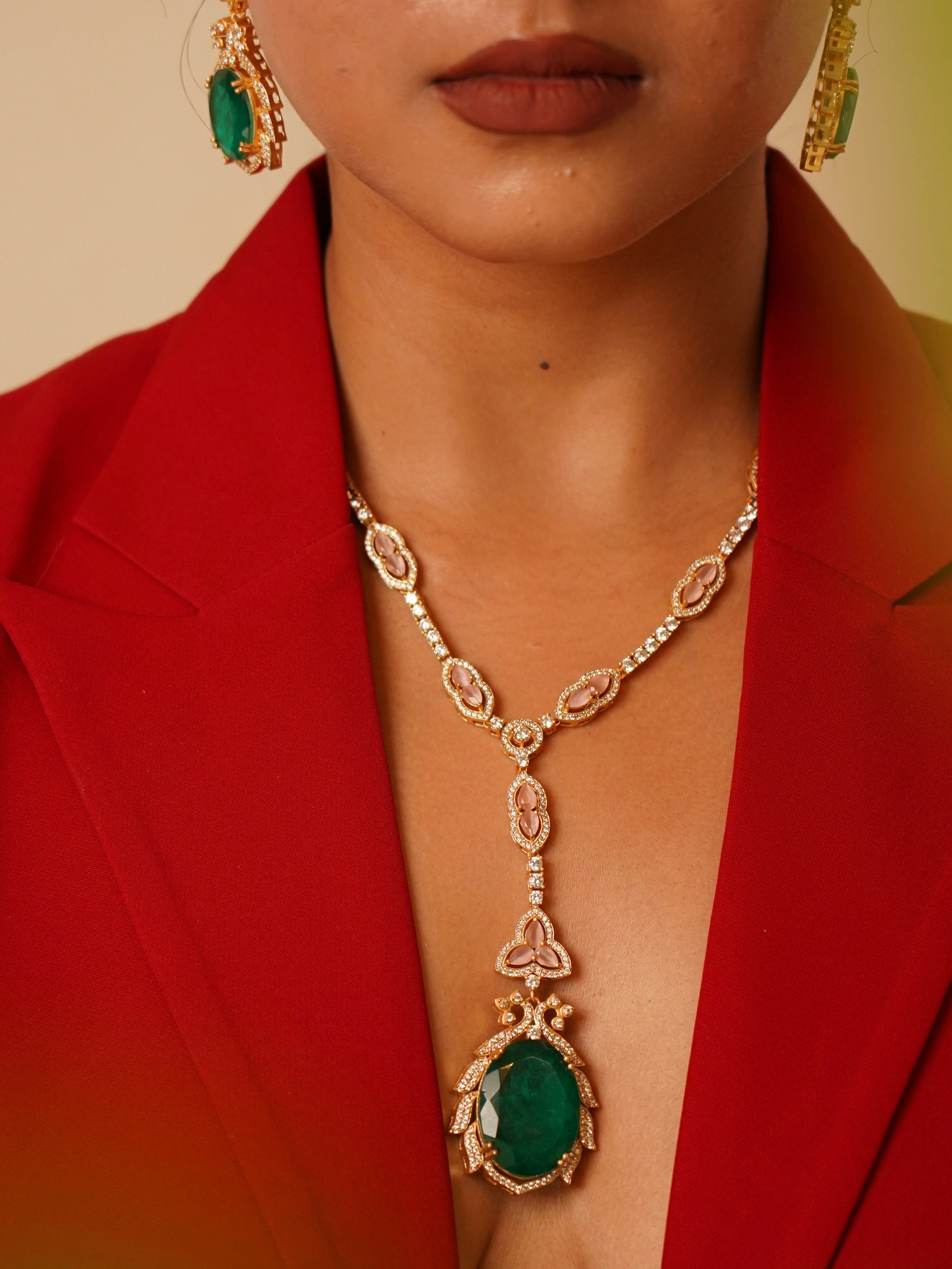 Angled view of noorie necklace set featuring curved motifs and stone embellishments