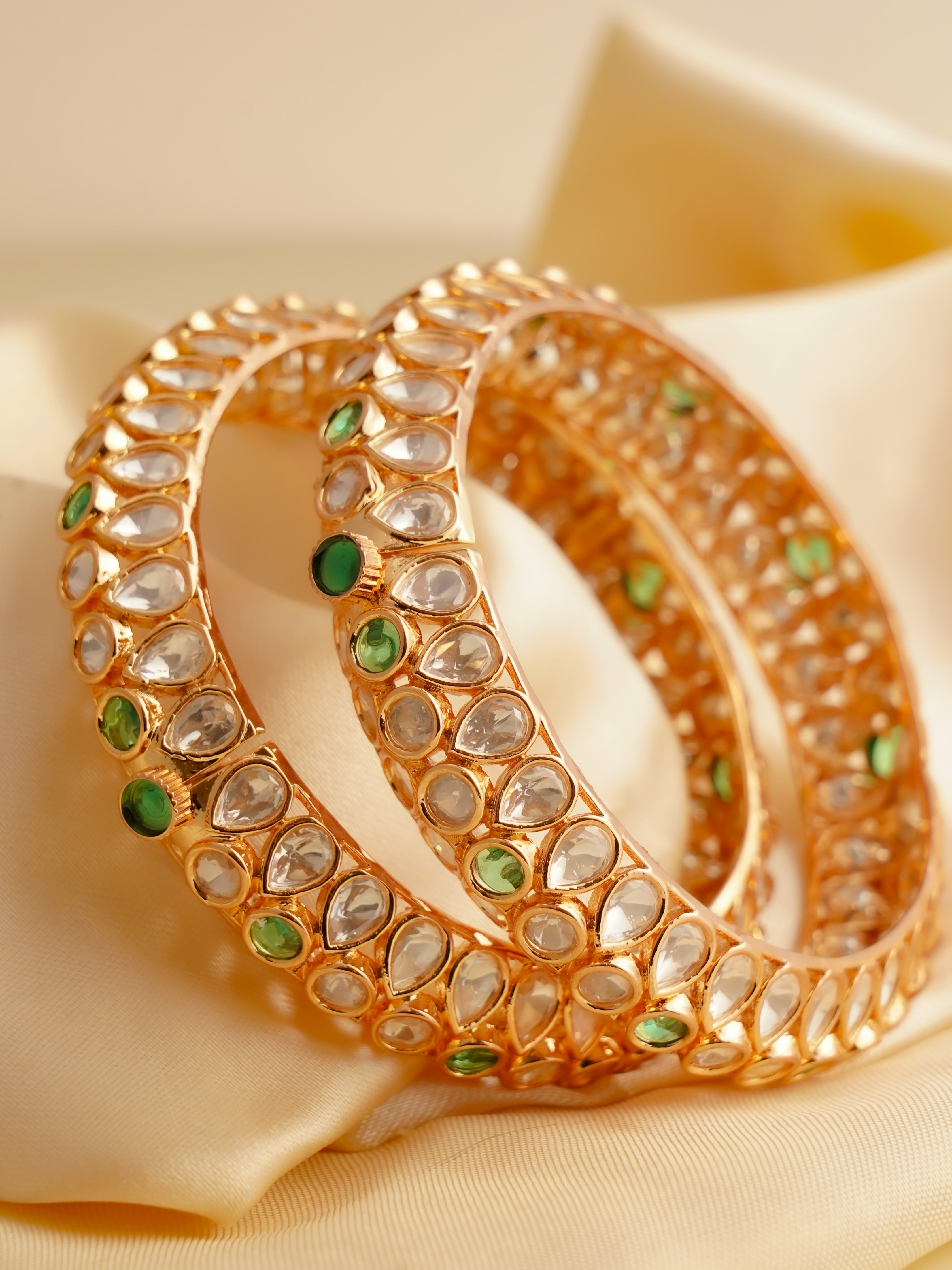 Detail view of polki bangles set showing stone density and rounded openable form