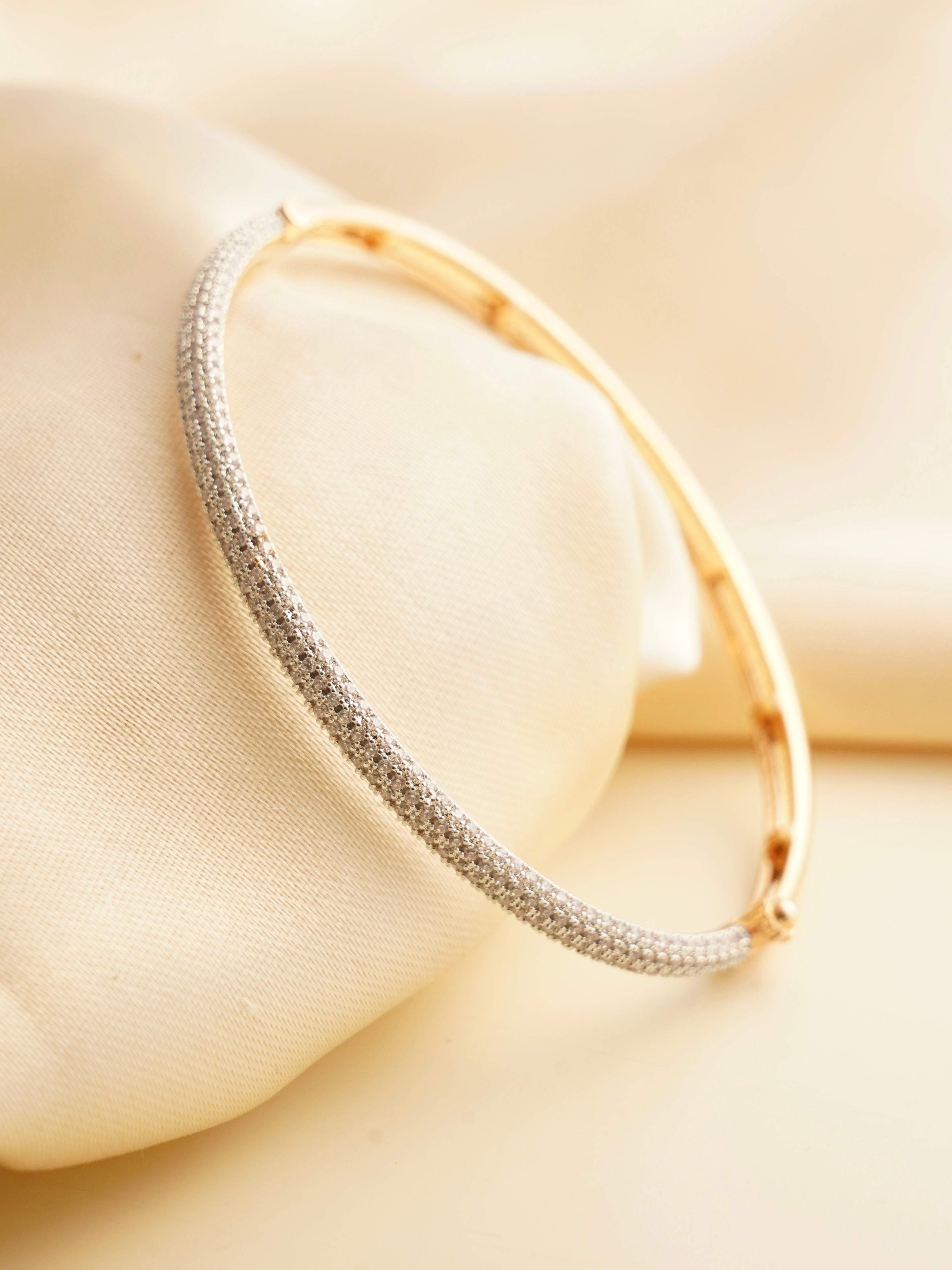 Side view of lightweight party wear bracelet in gold plating with seamless edges