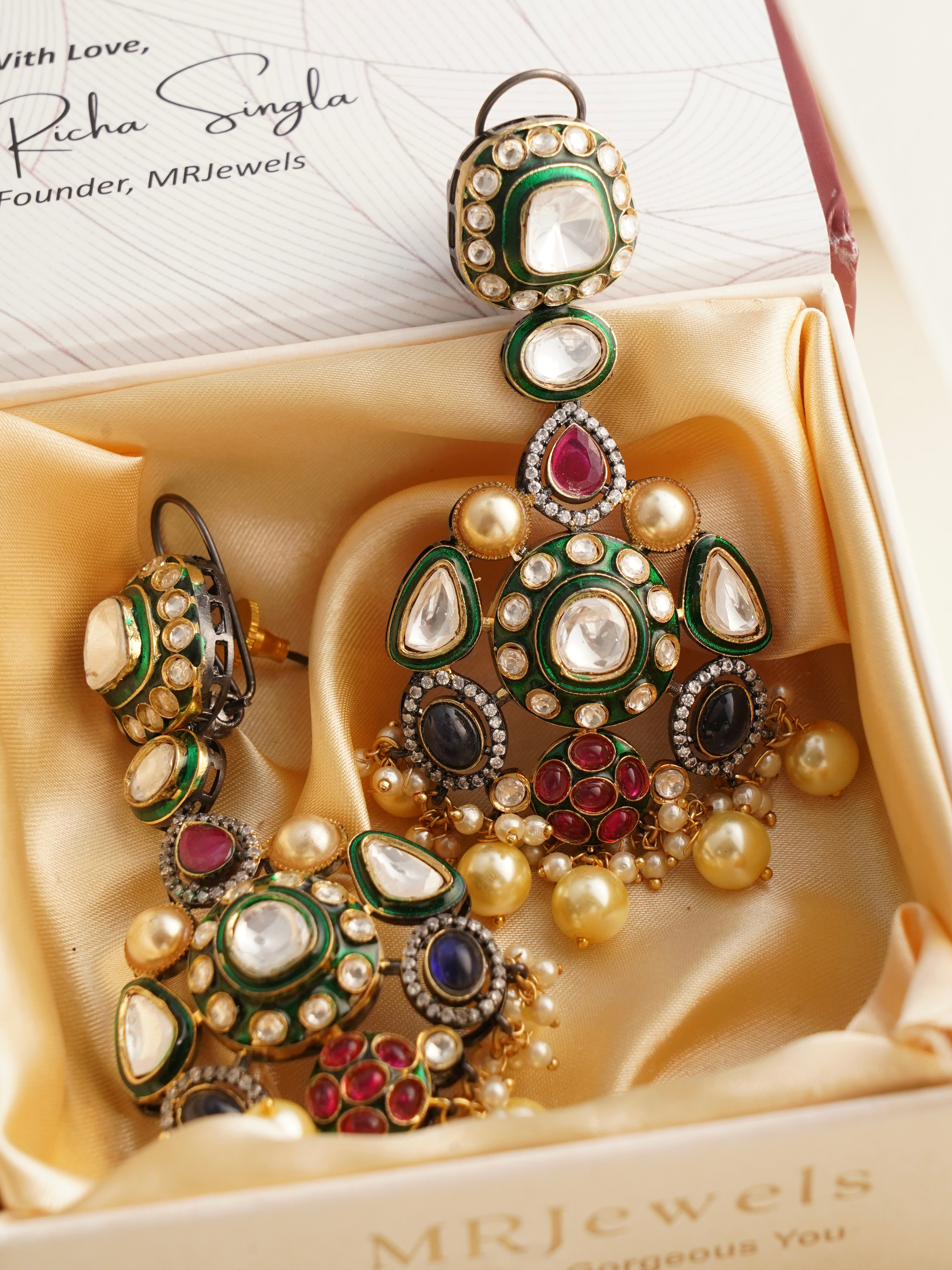 Side profile of Victorian earrings showcasing colorful stones and vintage design