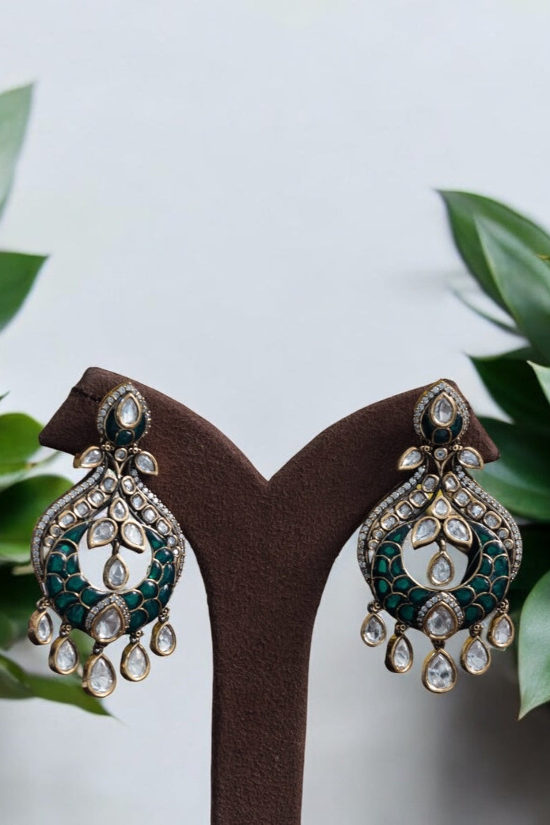 Polki kundan earrings with layered design and shimmering gold-toned finish