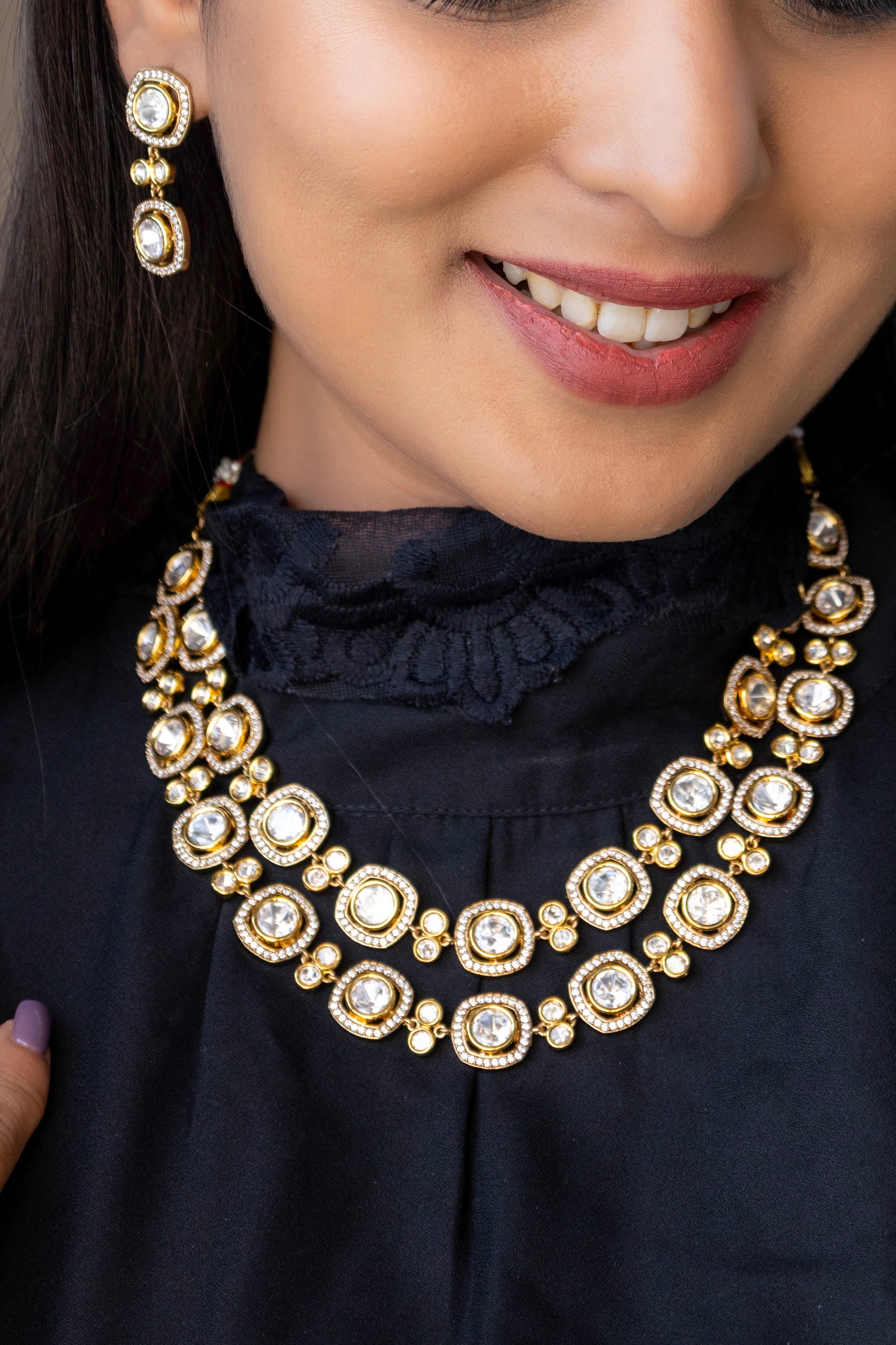 Close-up of kundan necklace highlighting layered structure and traditional gemstone setting