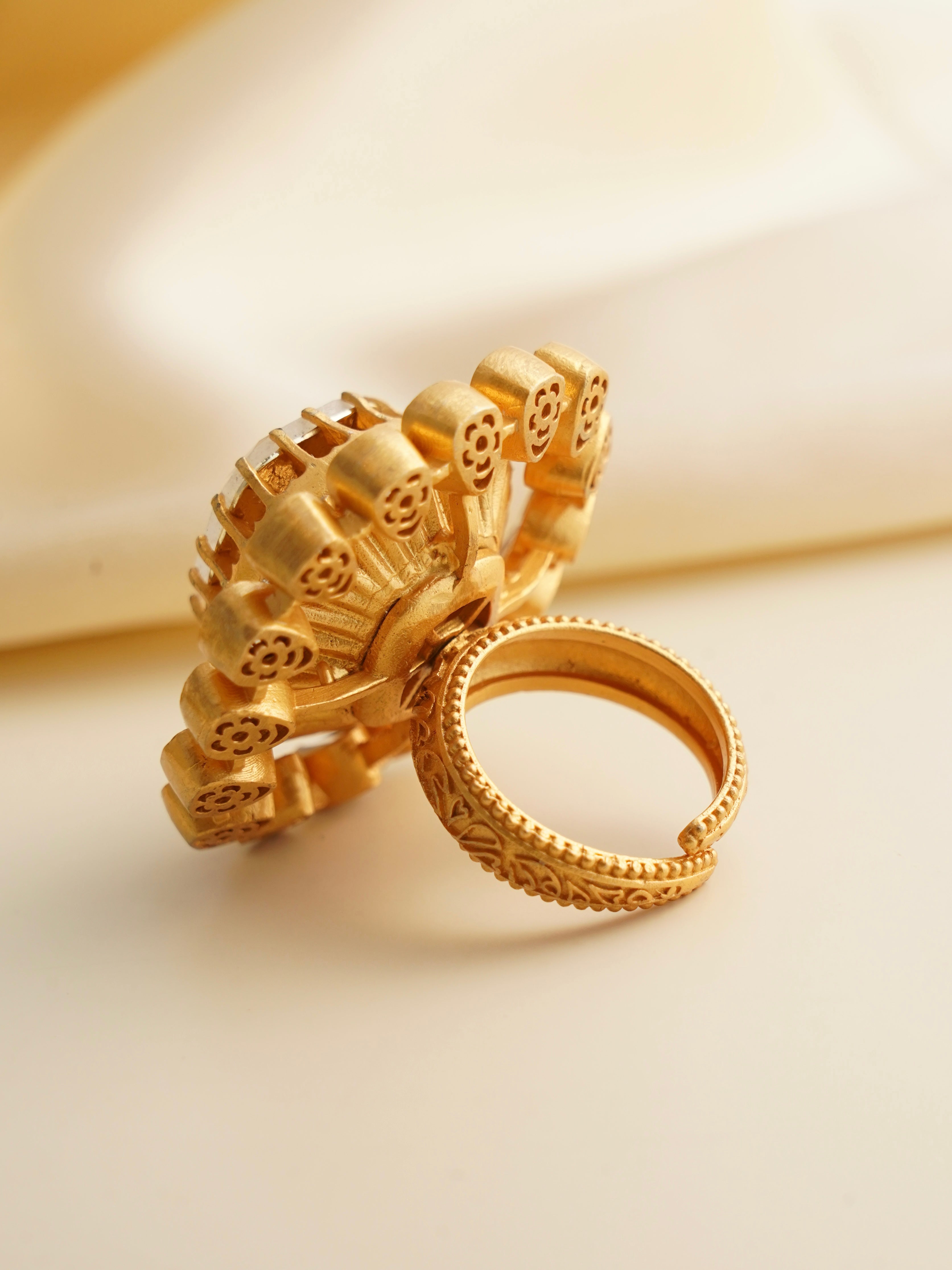 Moissanite statement ring with layered petal design and gold-plated open band