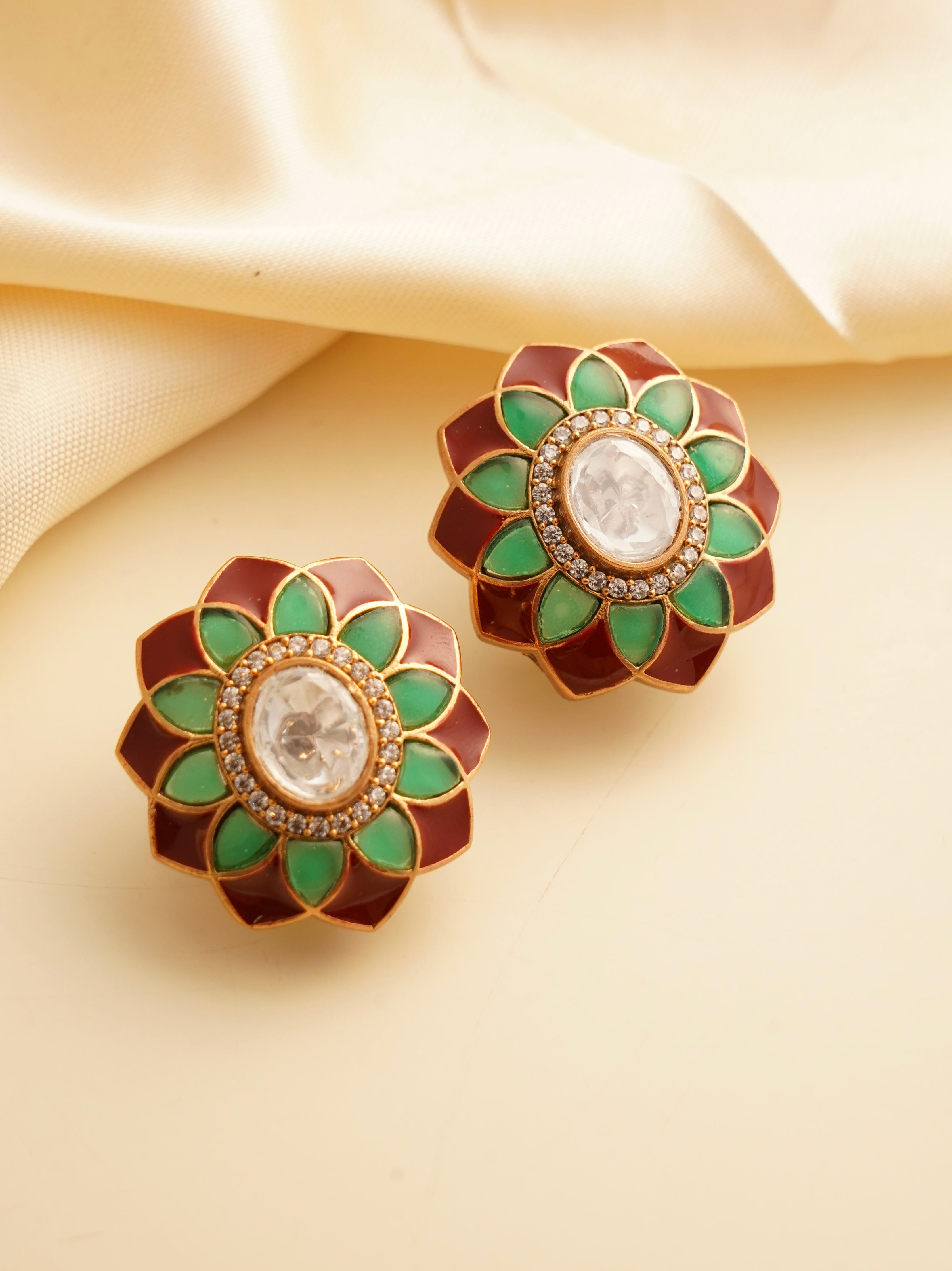 Polki flower studs with green and maroon enamel petals encircling a central uncut stone