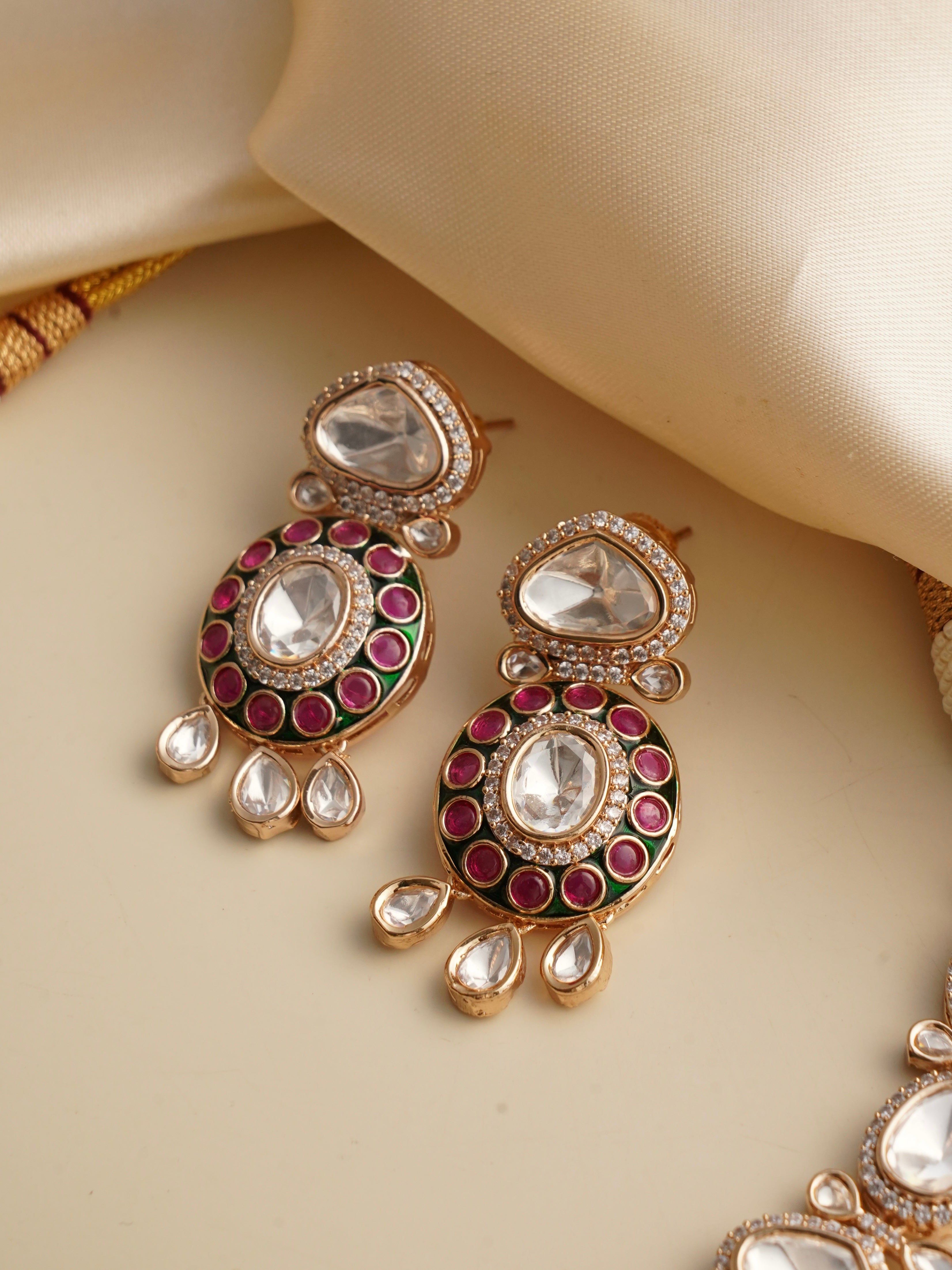 Front view of meenakari necklace set with floral enamel work and matching earrings