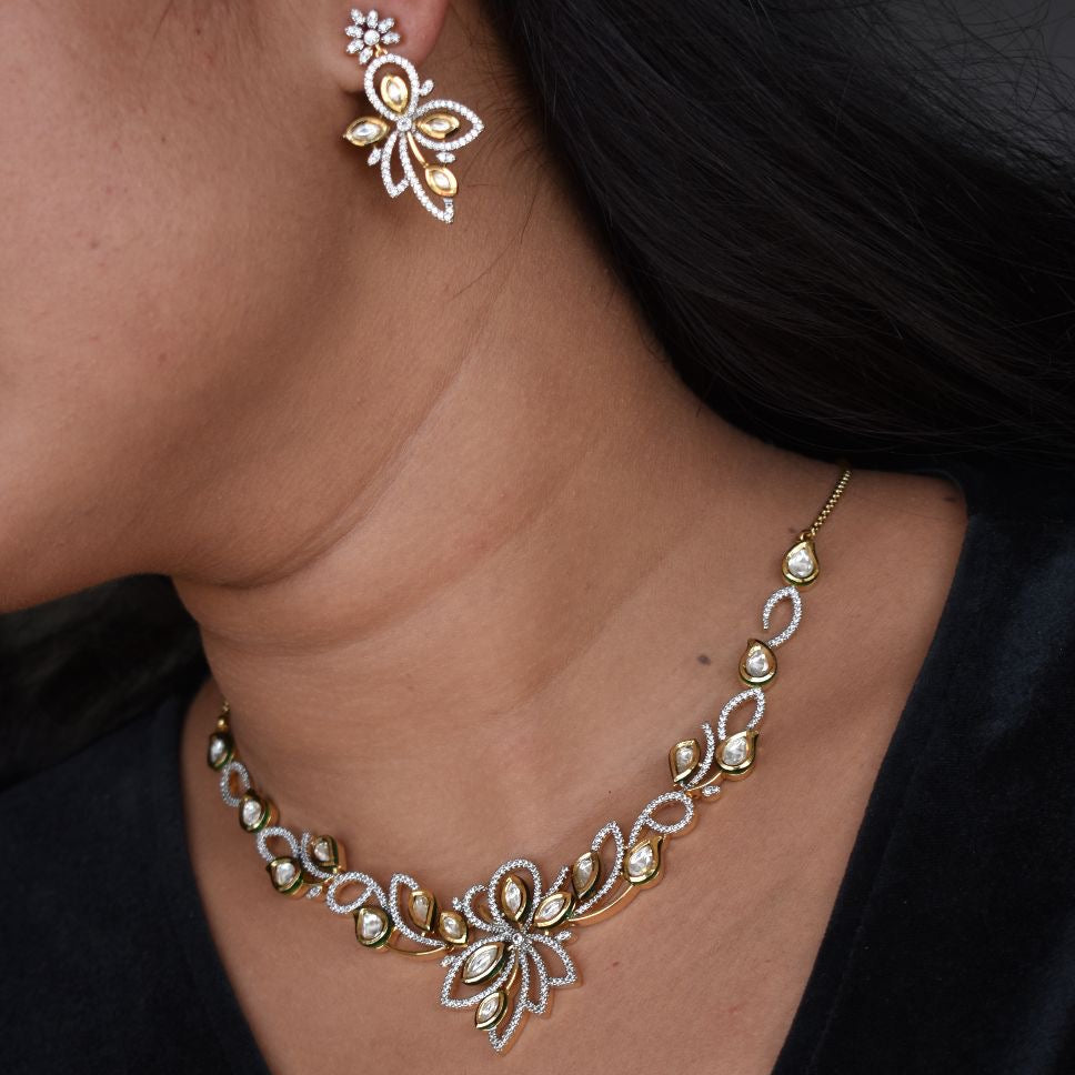 Dewdrop kundan necklace set with gold-plated floral vine design and matching earrings