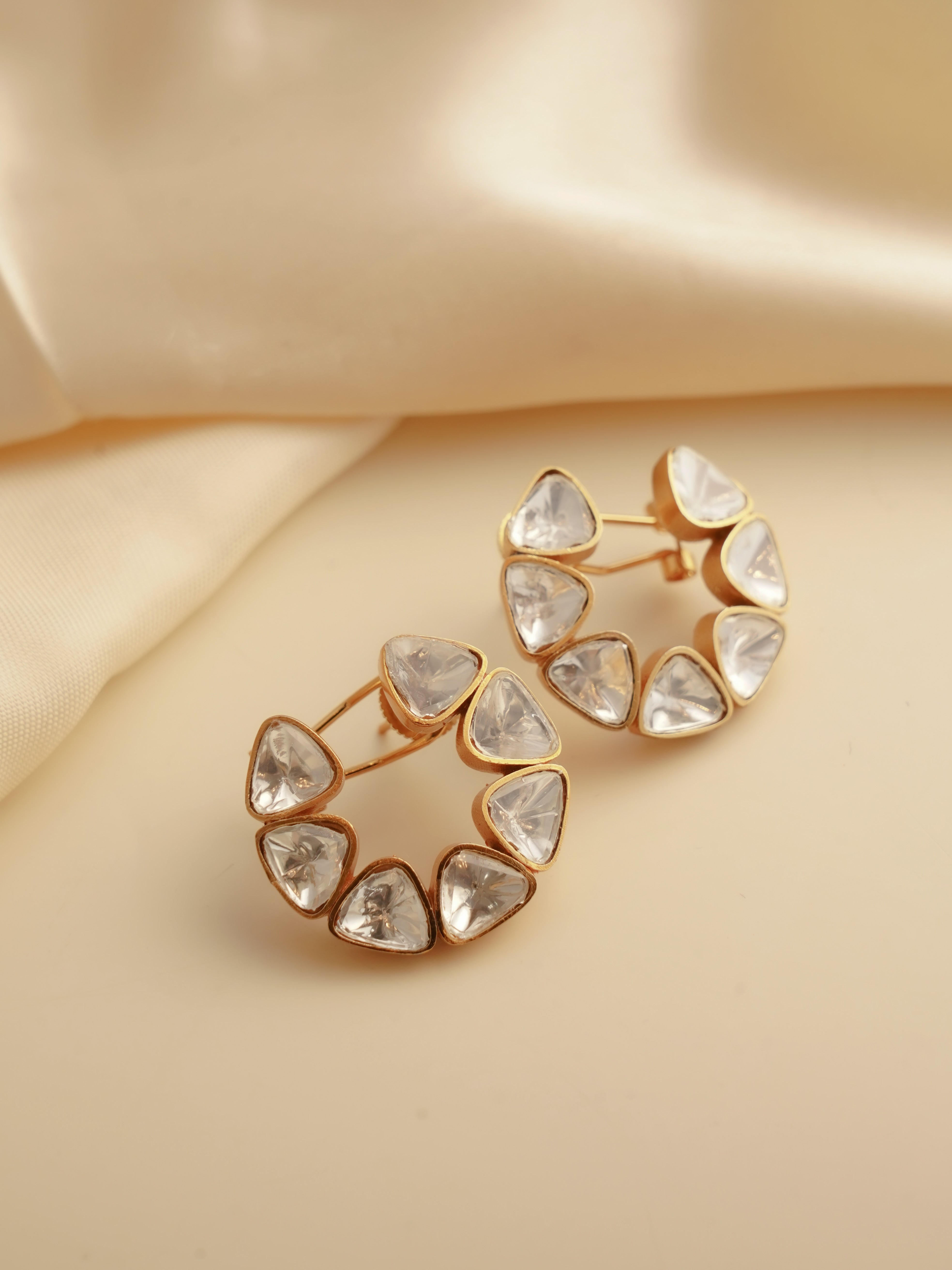 Uncut polki studs in circular design with raw finish and natural sparkle
