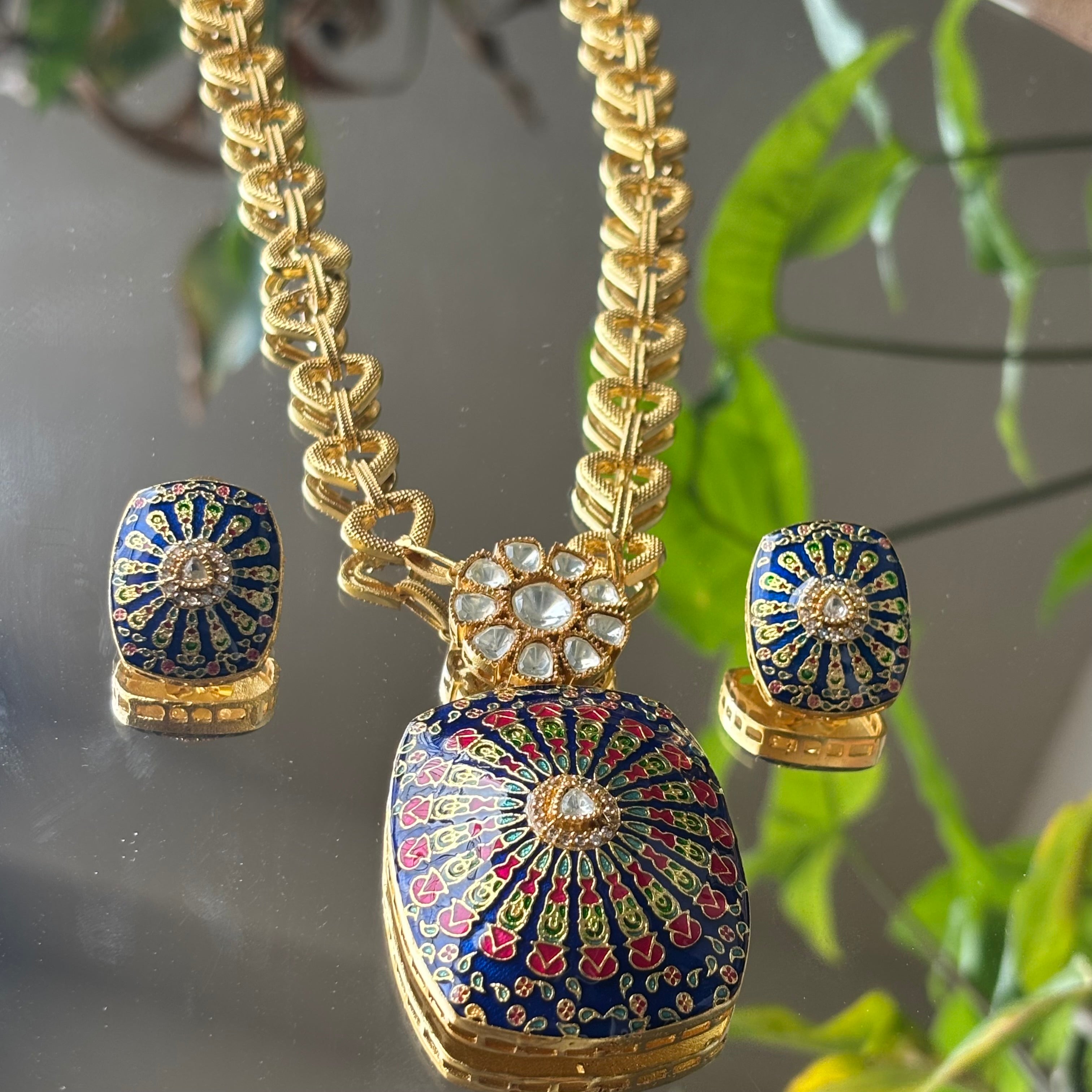 Side angle of fusion meenakari pendant set with earrings and detailed finish