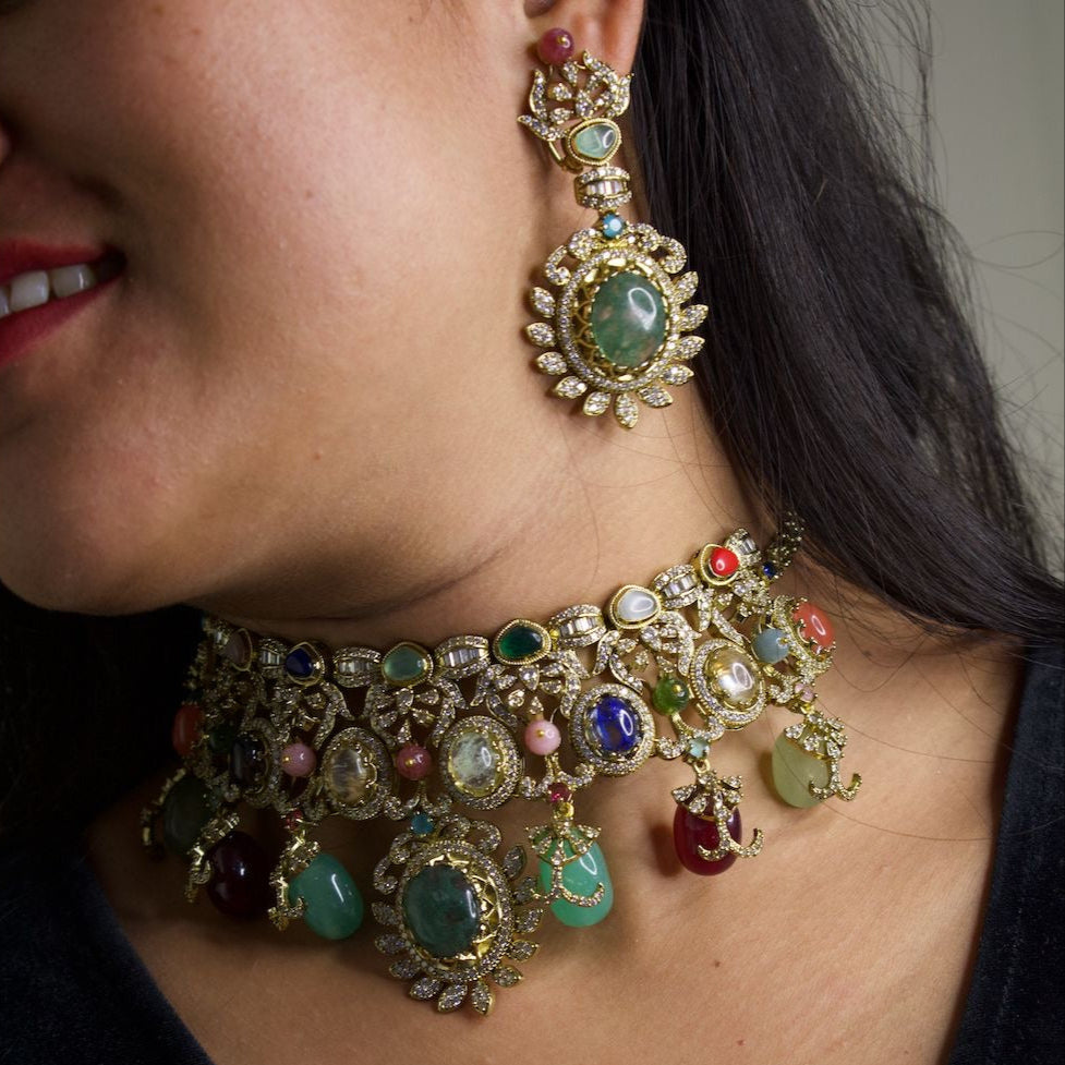 Close-up showing luxe choker and earring set with polished natural gemstones and fine texture
