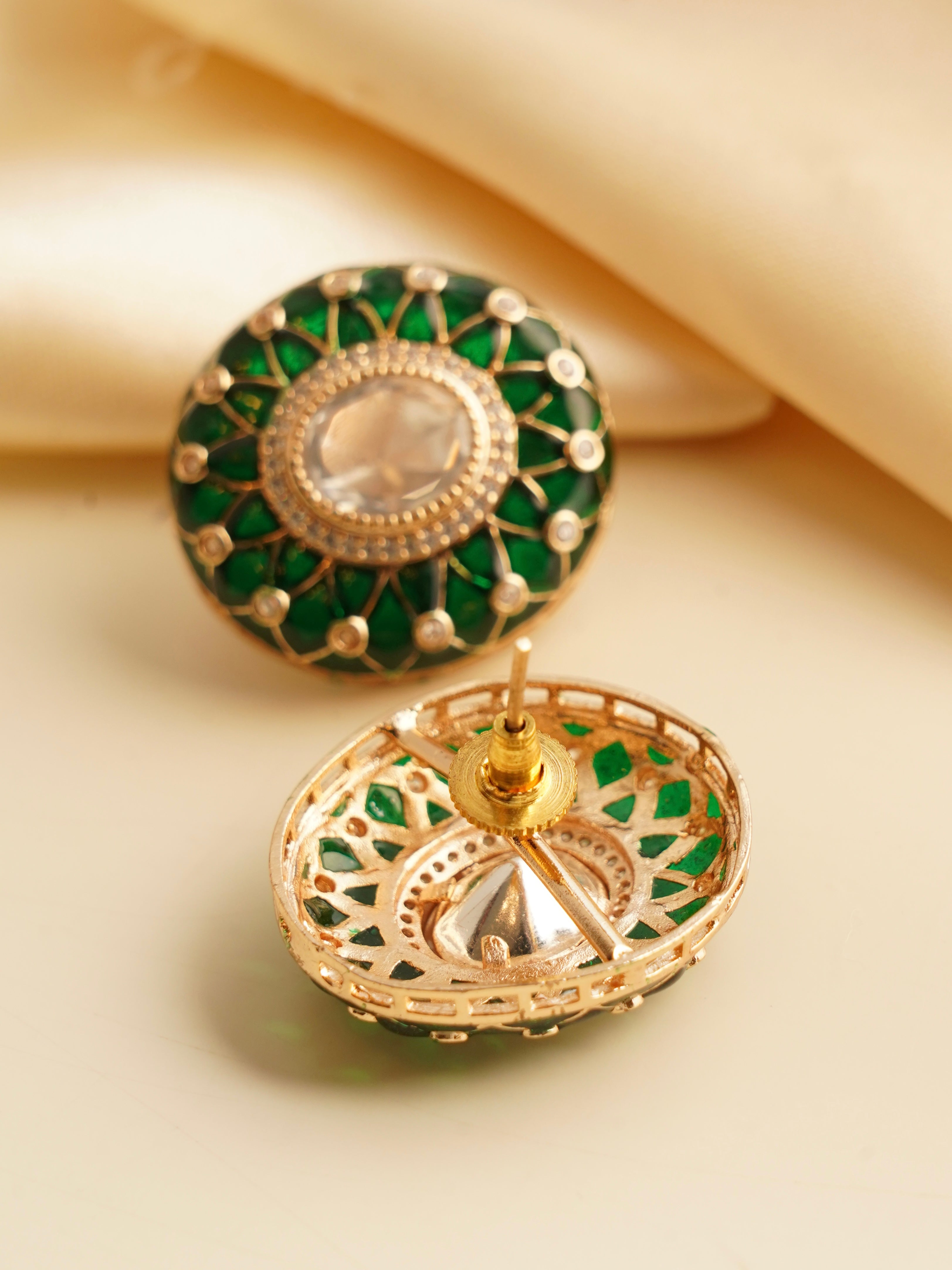 Close-up of scarlet bloom earrings showing stone setting and intricate enamel work