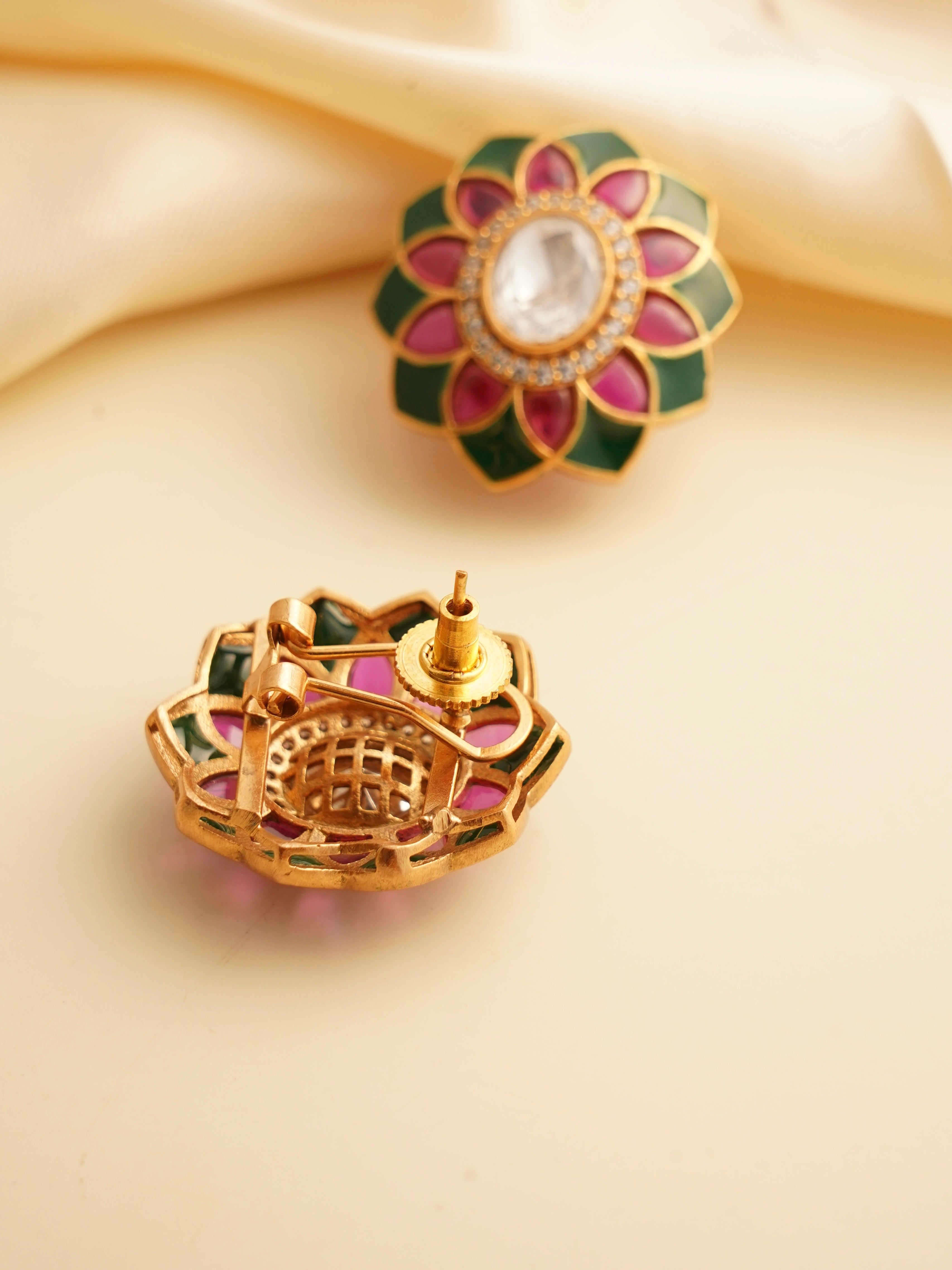 Back view of polki flower stud showing screw‑back closure with green and fuchsia enamel petals