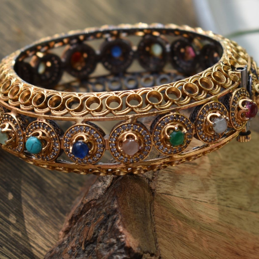 Angled view of silver alloy bangles in vibrant hues with smooth finish