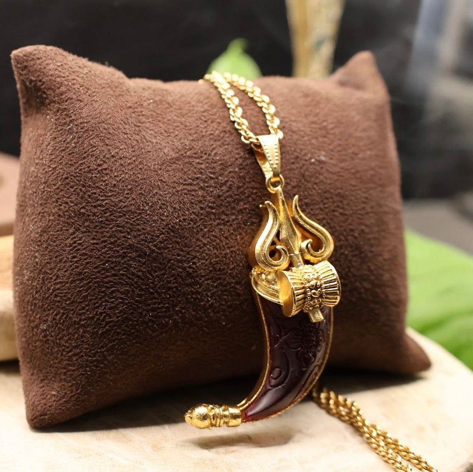 Side angle of Trishul pendant with bold stone detail and classic brass chain