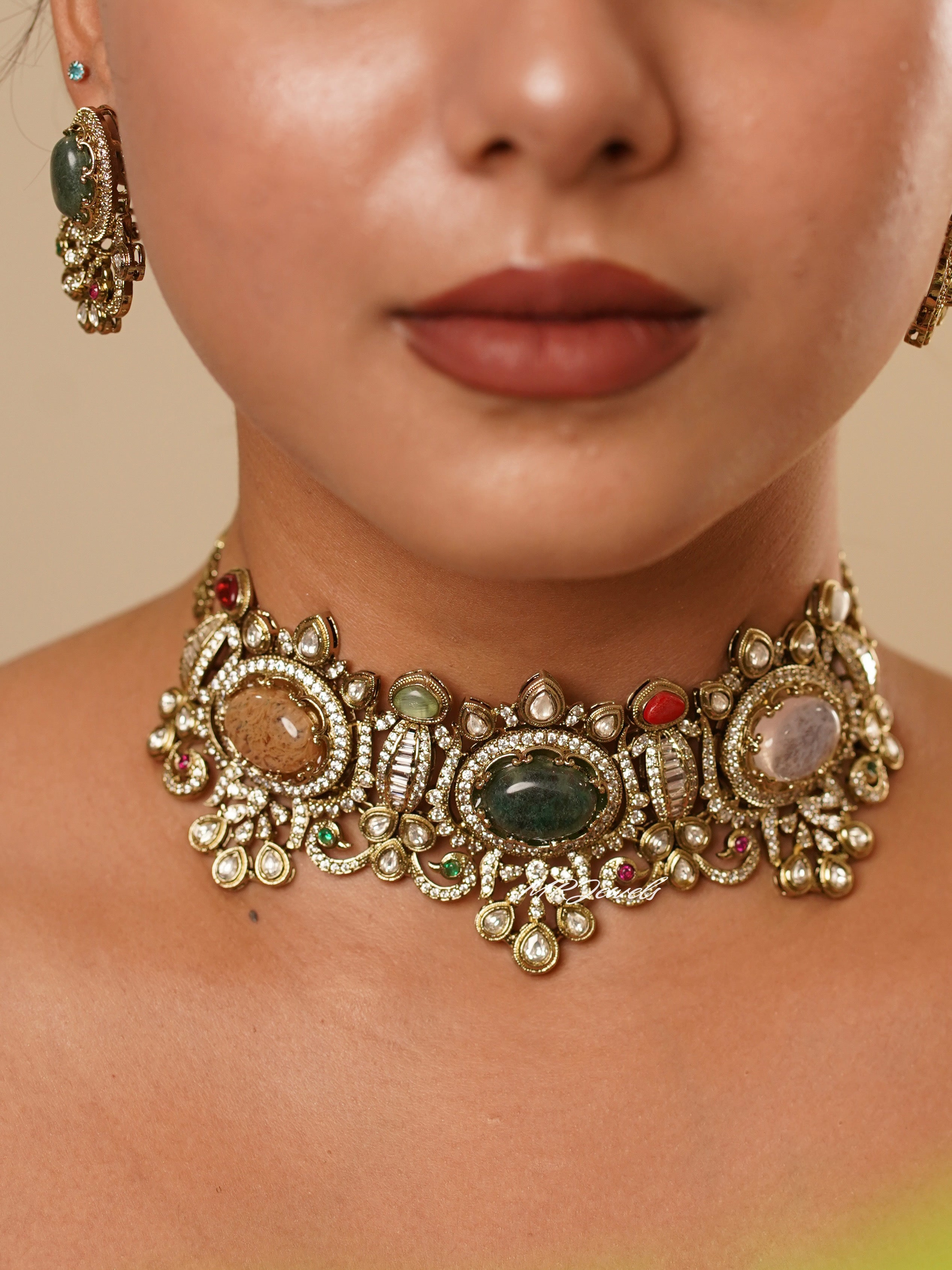 Close-up of matching earrings from riwaayat set with floral motifs and vintage-inspired polki design