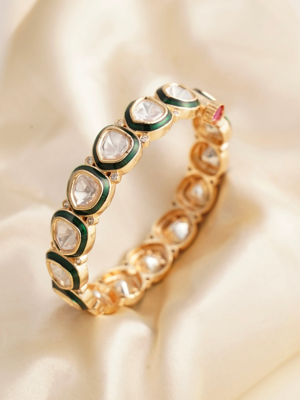 Kundan polki bangle with emerald enamel border and ruby-hued clasp in antique finish