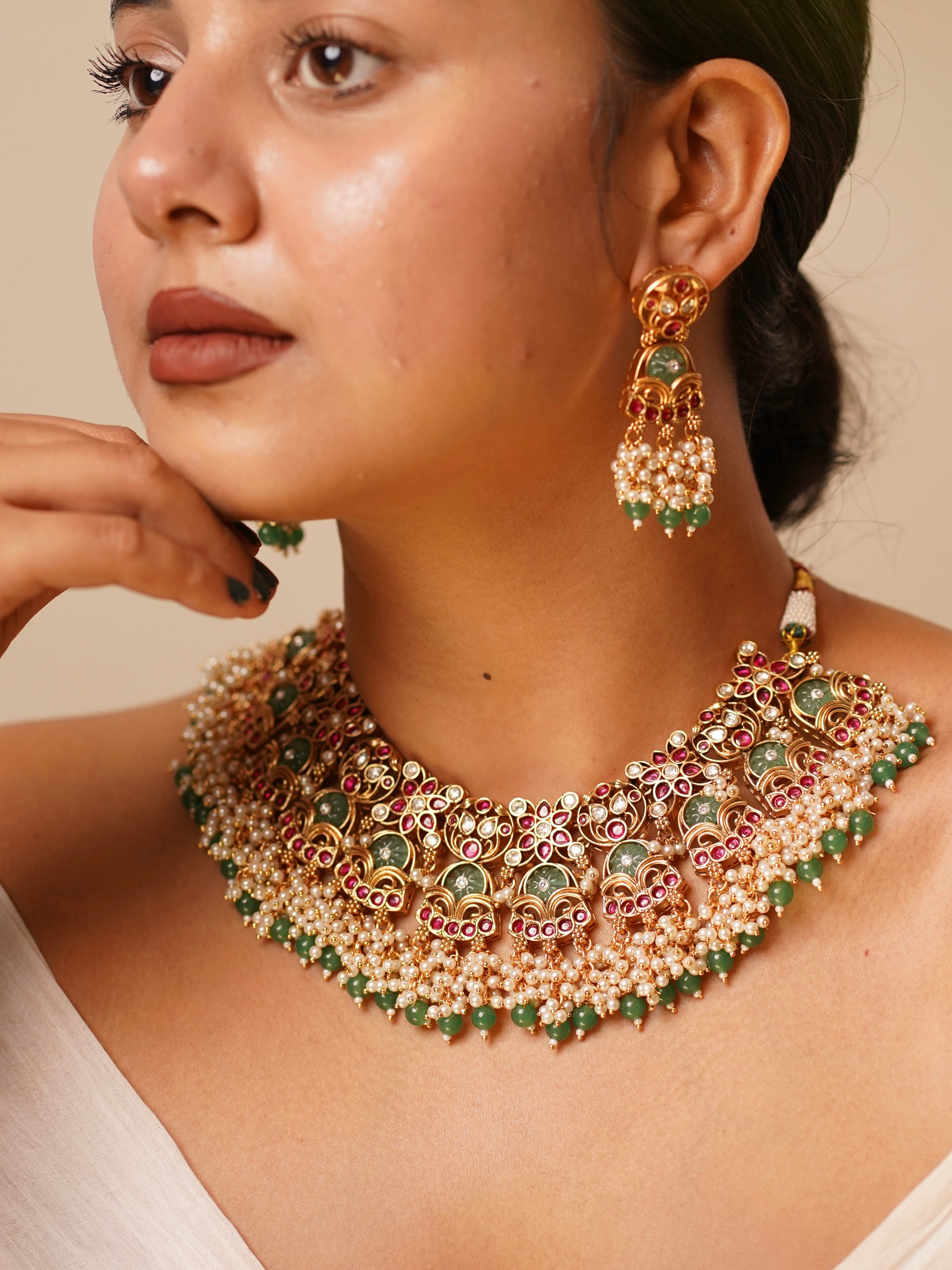 Antique gold temple choker with ruby accents, emerald enamel, and ivory pearl strands