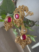 Alternate angle of traditional gemstone necklace with drop earrings and engraved pendant