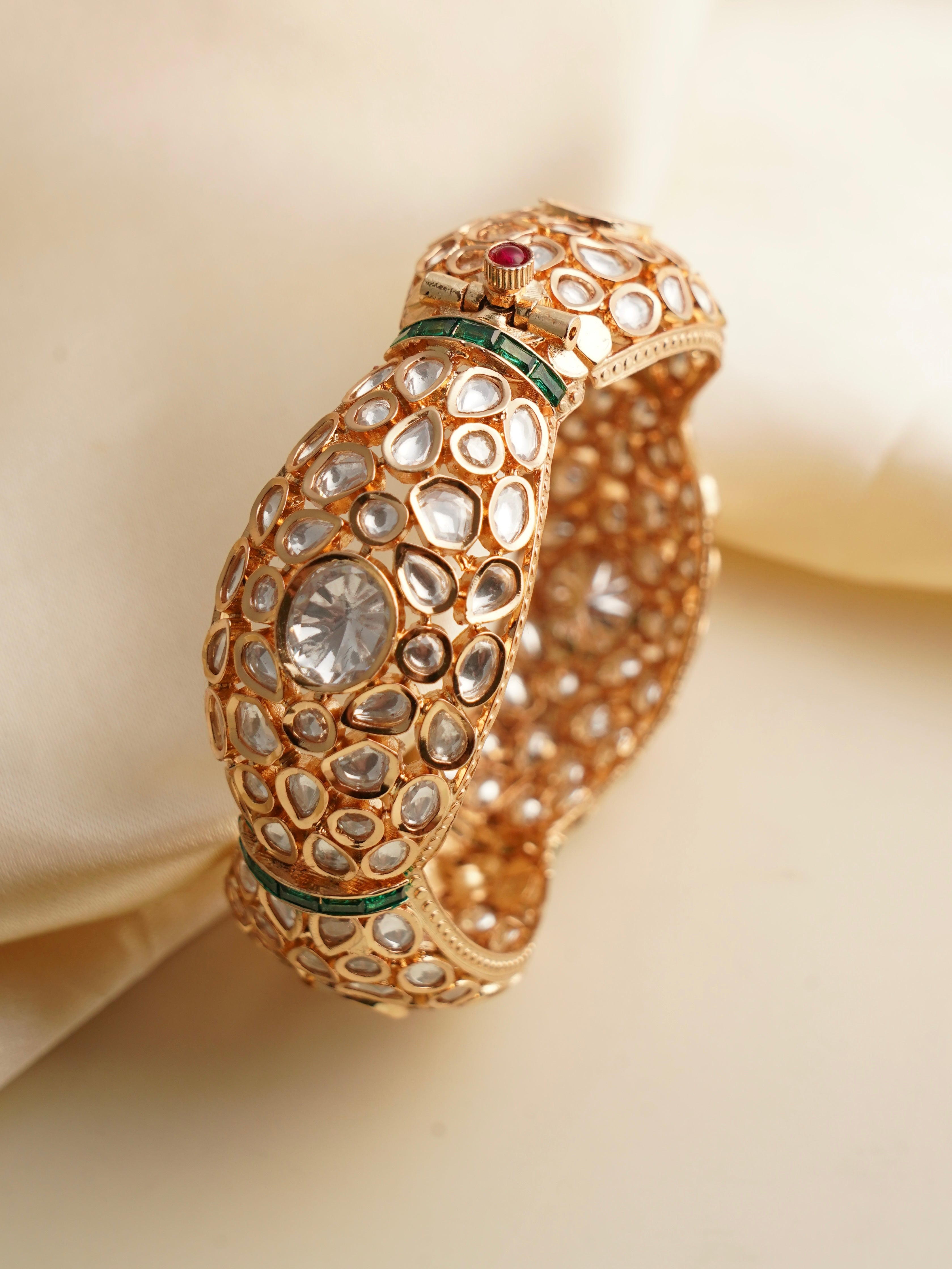 Detailed view of heritage kada featuring polki gems on gold-plated openable design