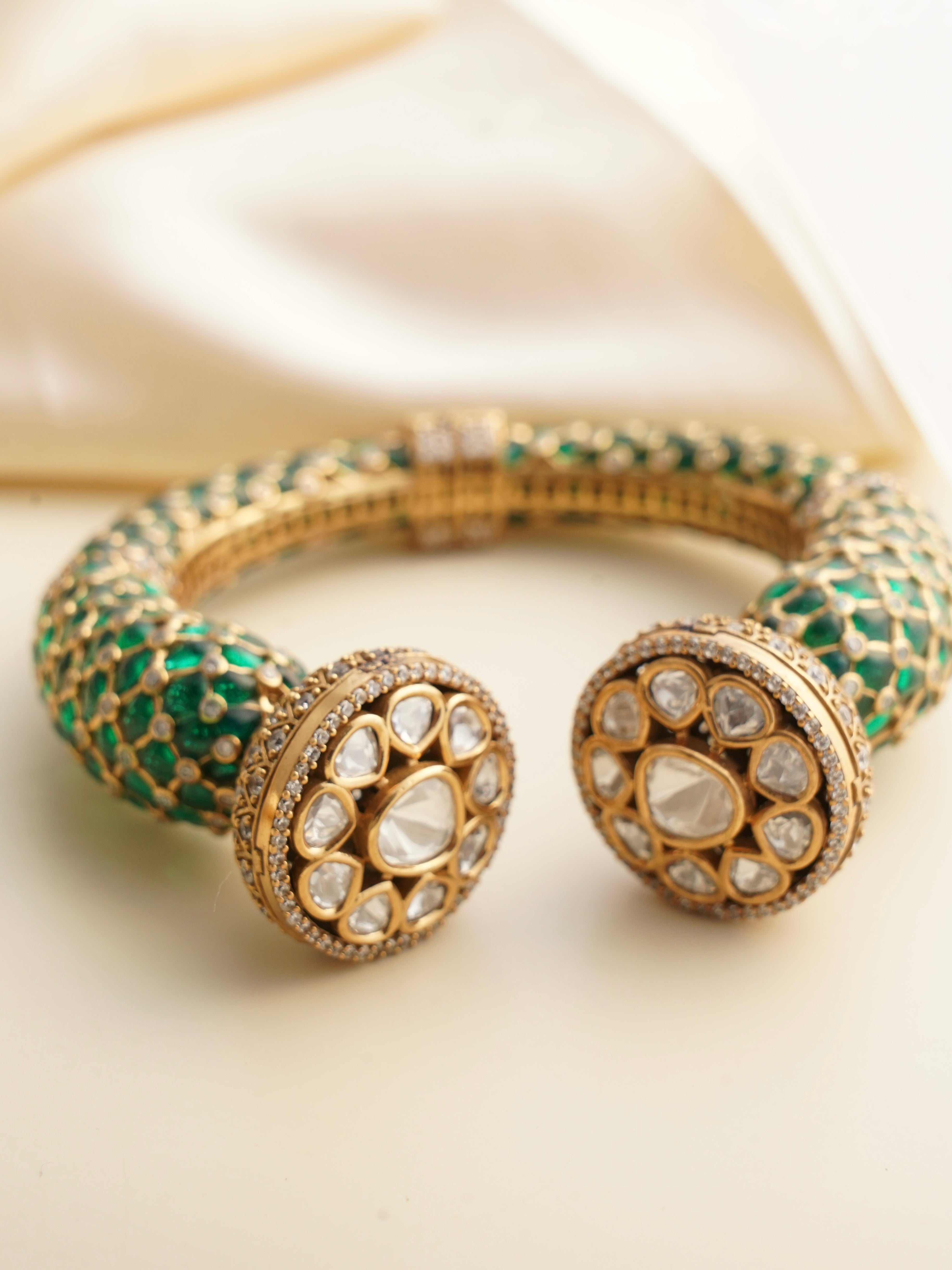 Backside view of enamel kada showing intricate detailing and secure fit