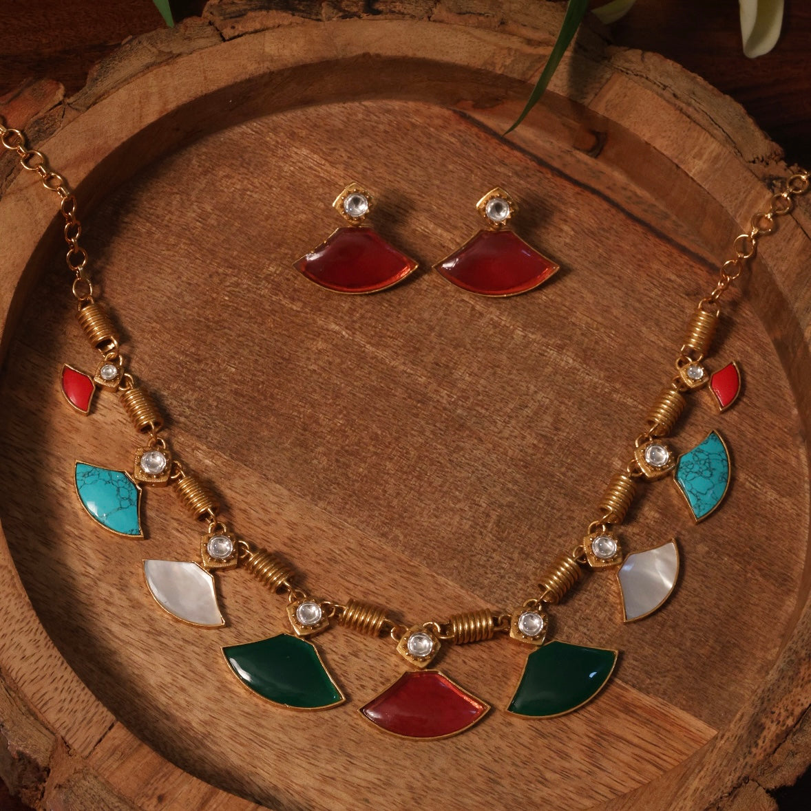 Rear view of necklace clasp and fine enamel detailing on copper base