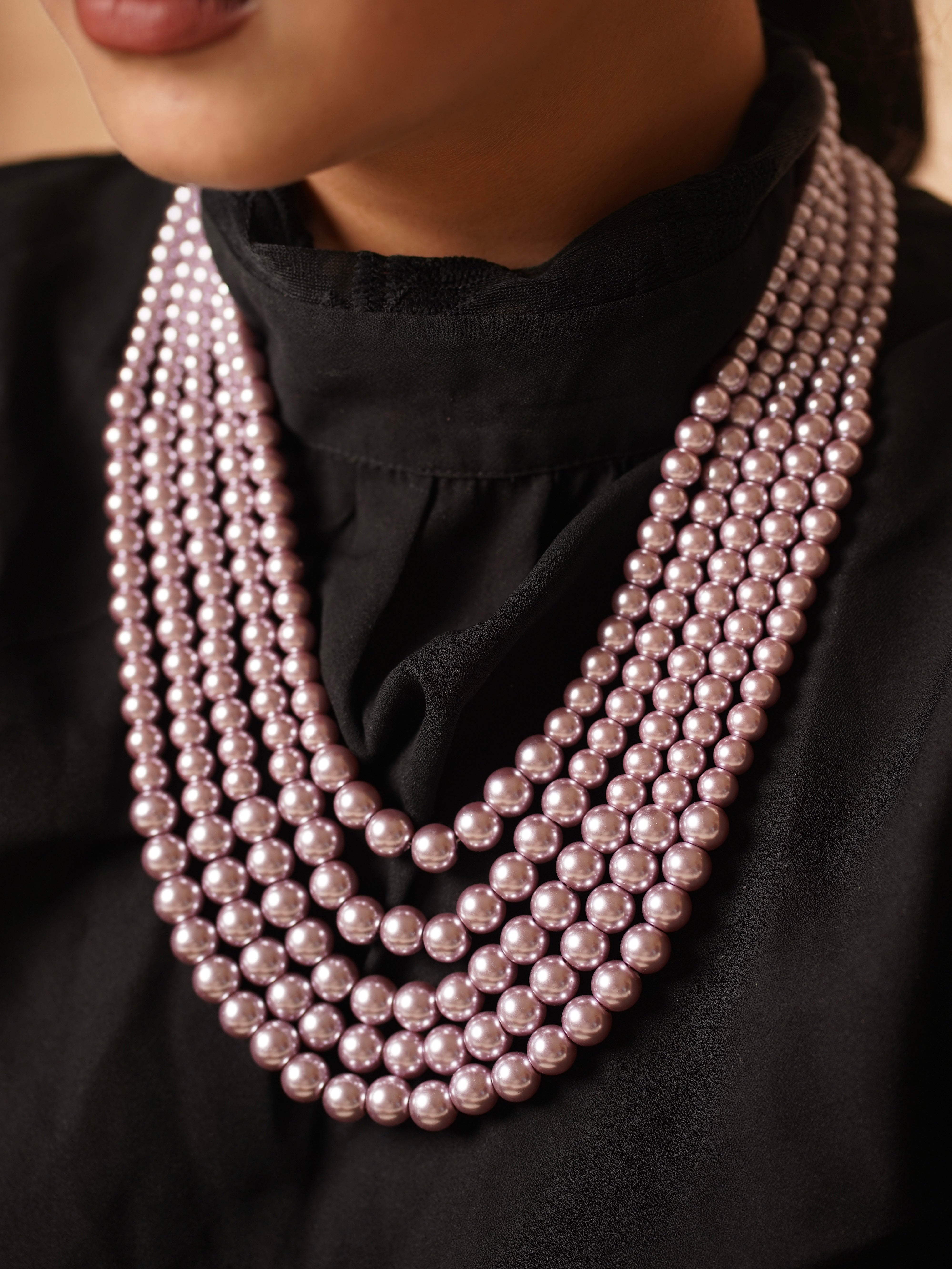 Rear view of pearl necklace highlighting clasp and structured drape