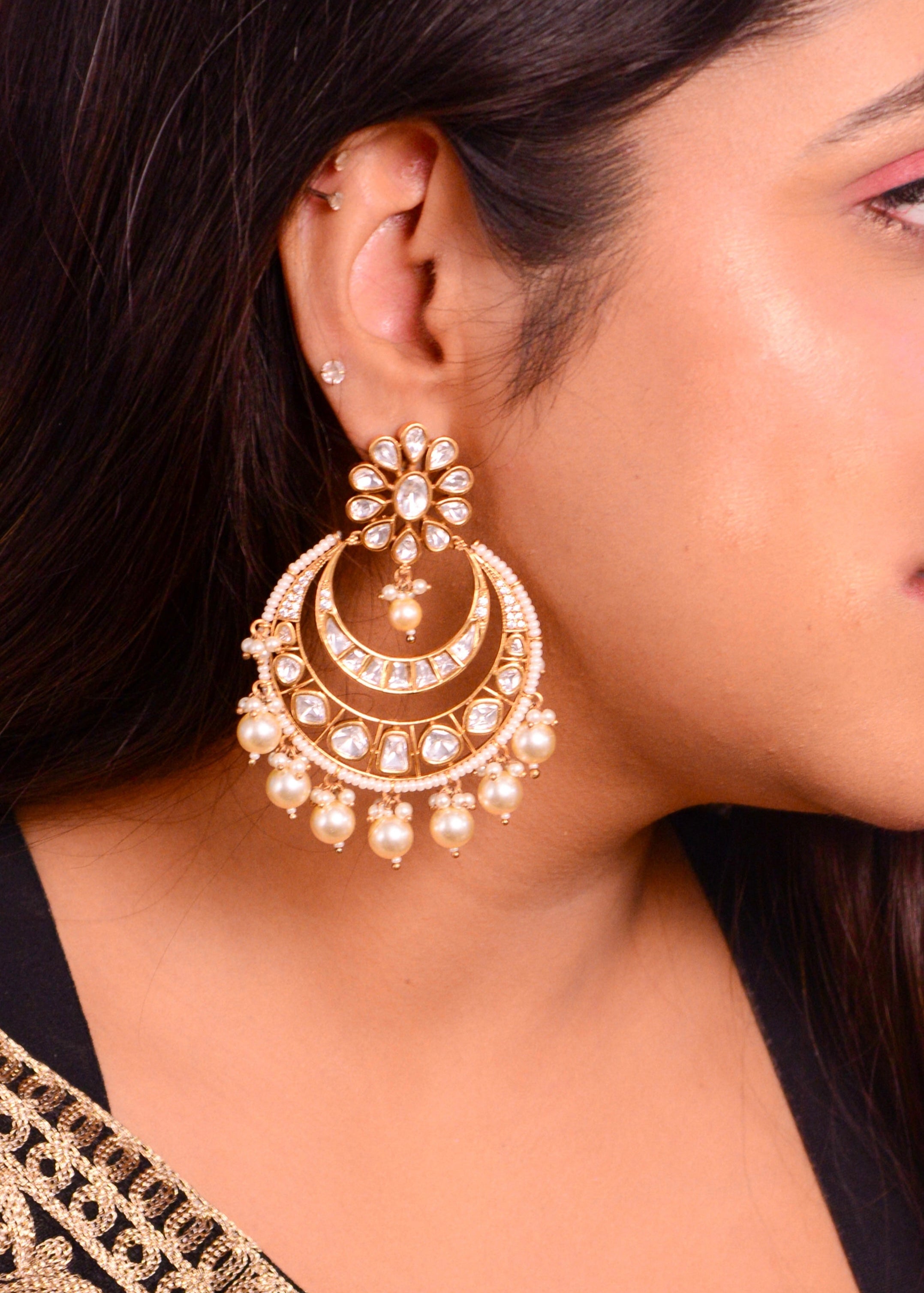 Chandbali earrings with layered kundan and pearl crescent design in tiered drop style