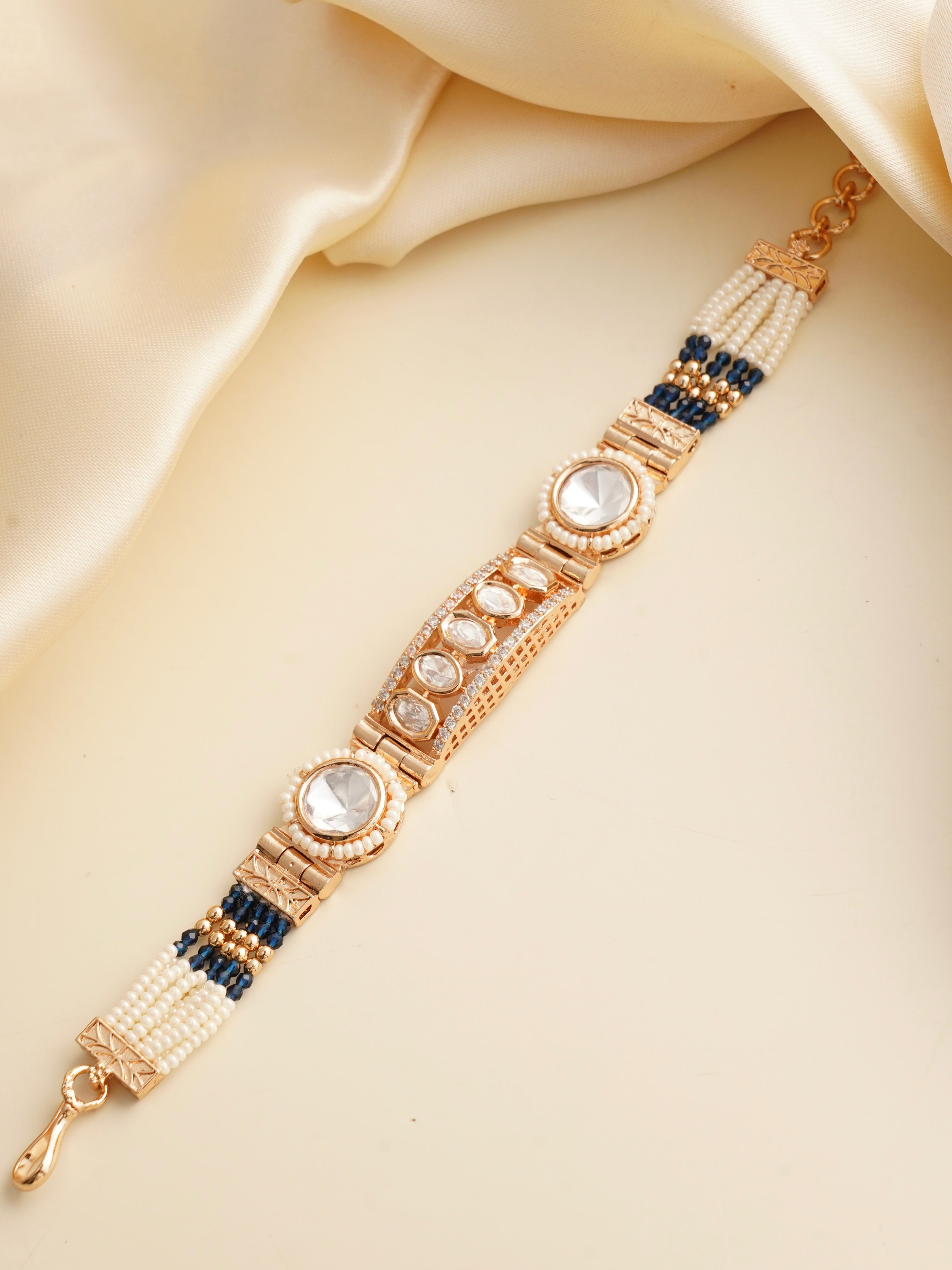 Bracelet clasp detail highlighting adjustable fit and gold-toned finish