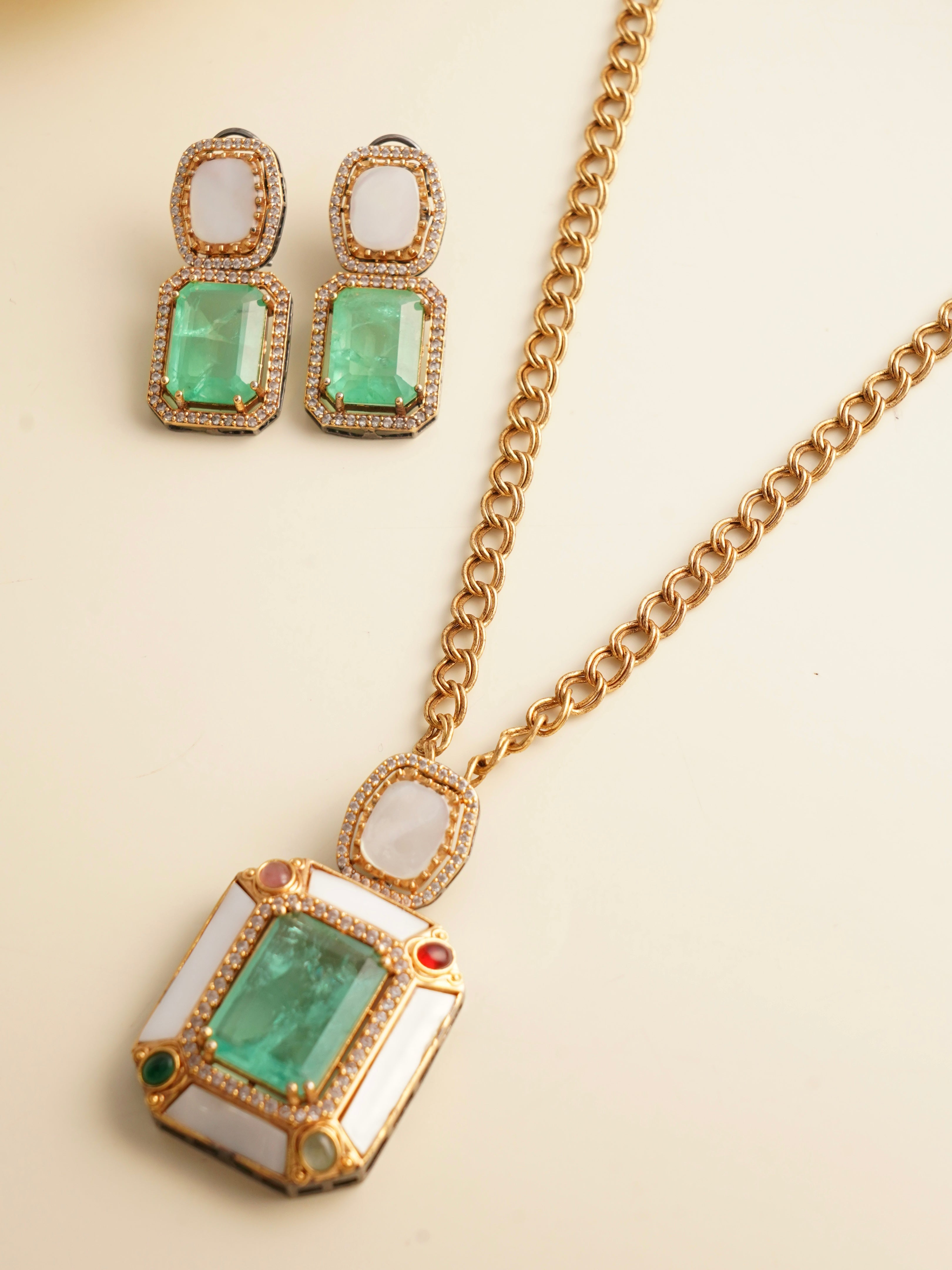 Earring close-up from emerald radiance set with pearl and gem embellishments