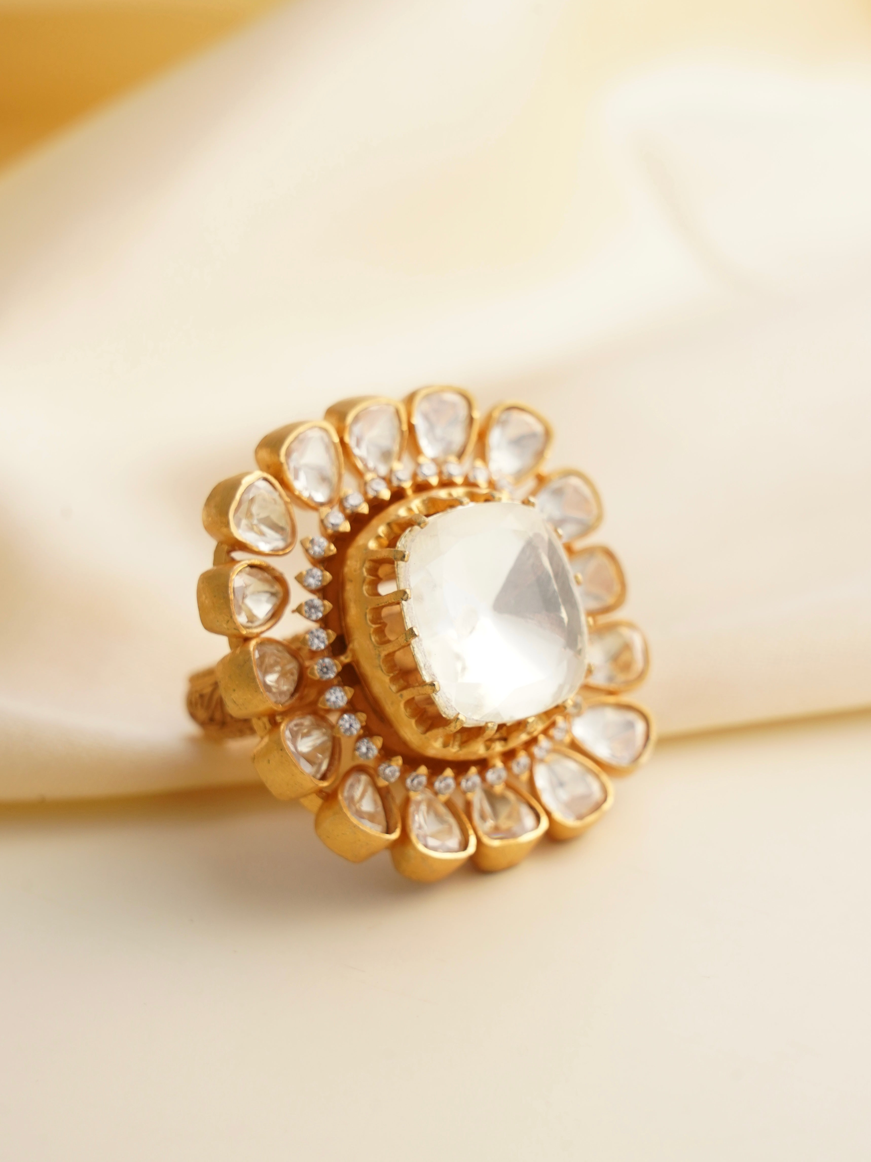 Angle view of moissanite statement ring showing intricate floral frame design