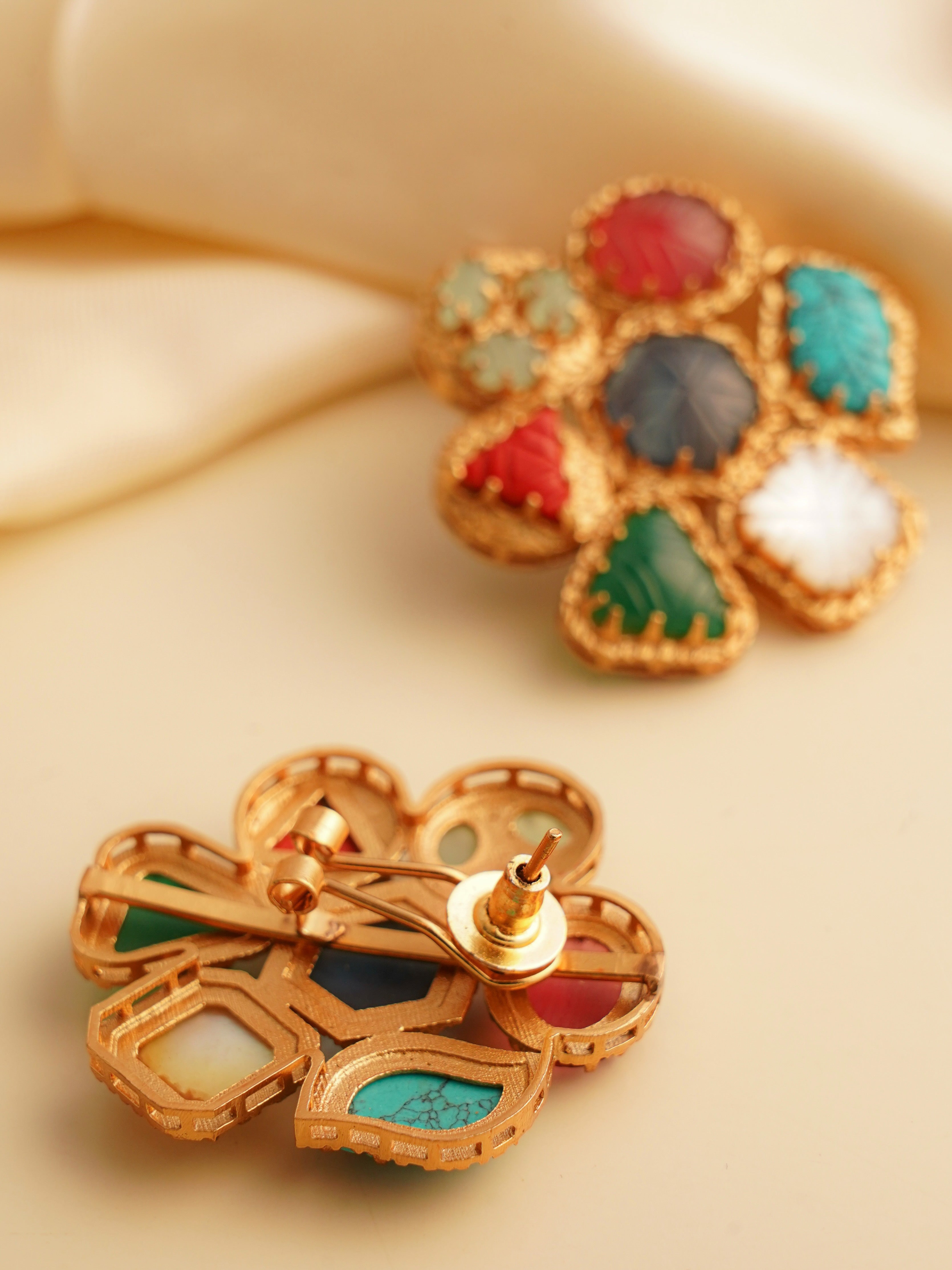 Pair of navratan earrings with carved gemstone detailing and antique finish