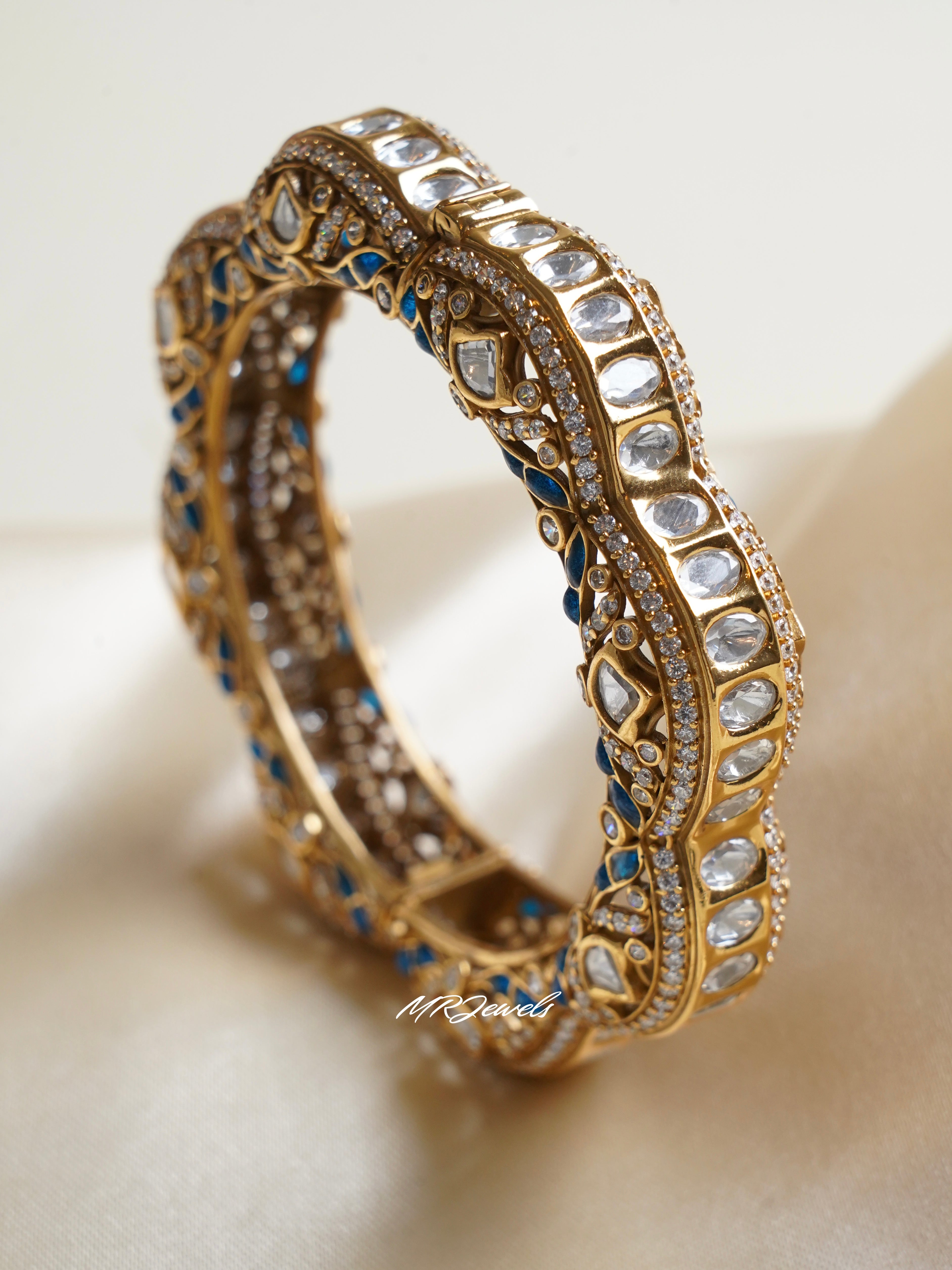 Top view of elegant polki kadas with symmetrical kundan design