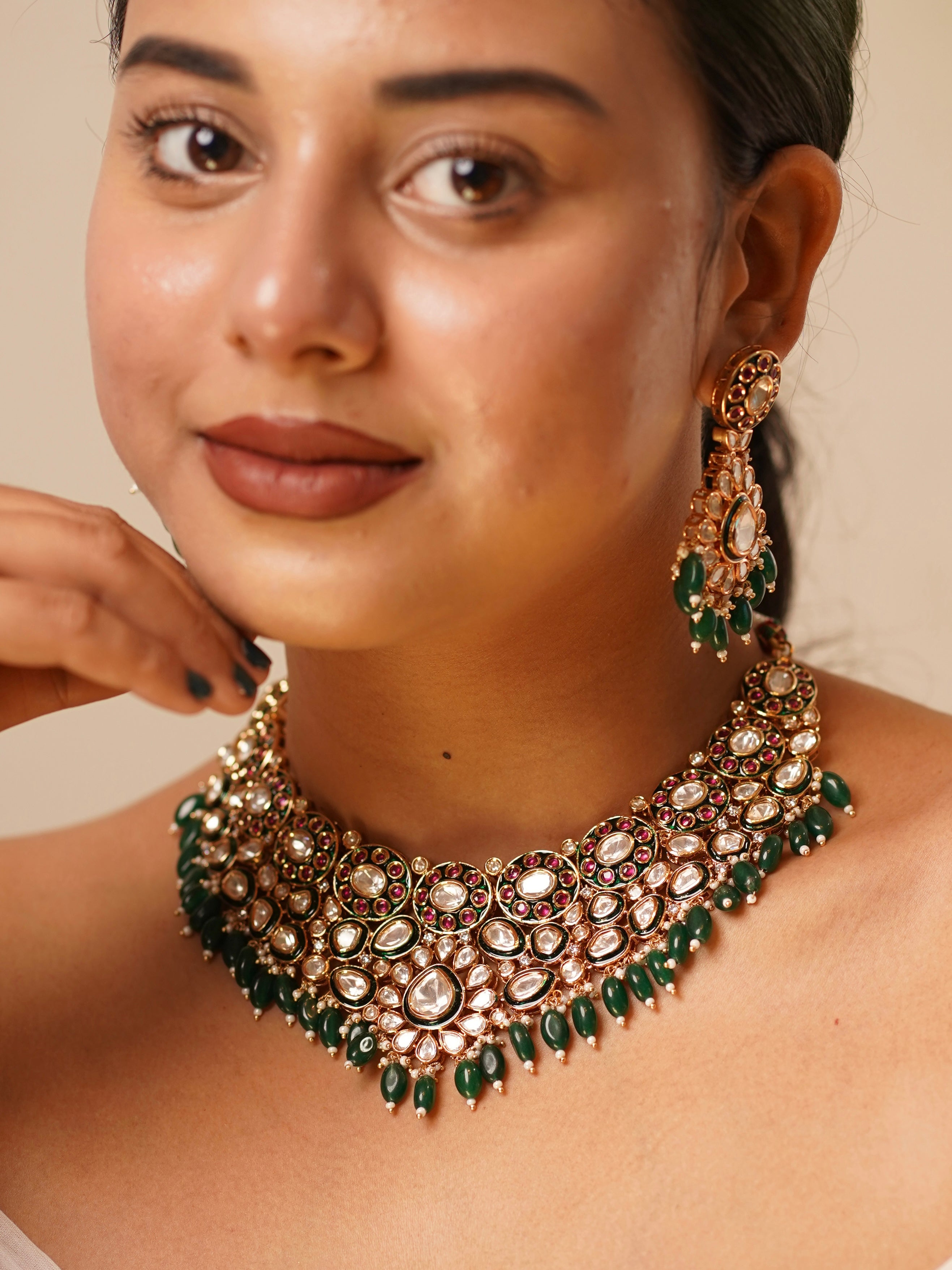 Angled view of bridal kundan necklace with enamel accents and polki detailing