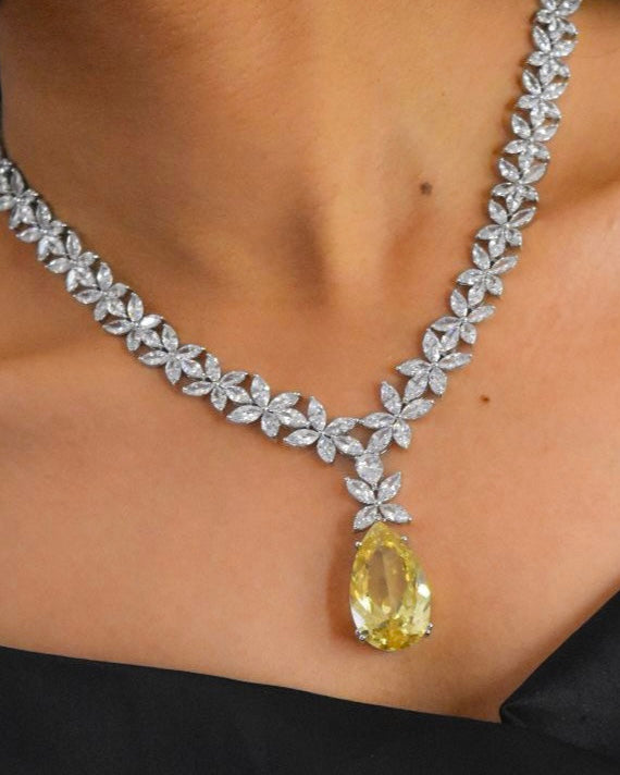 Front view of yellow sapphire stone drop necklace set with white rhodium-finished chain