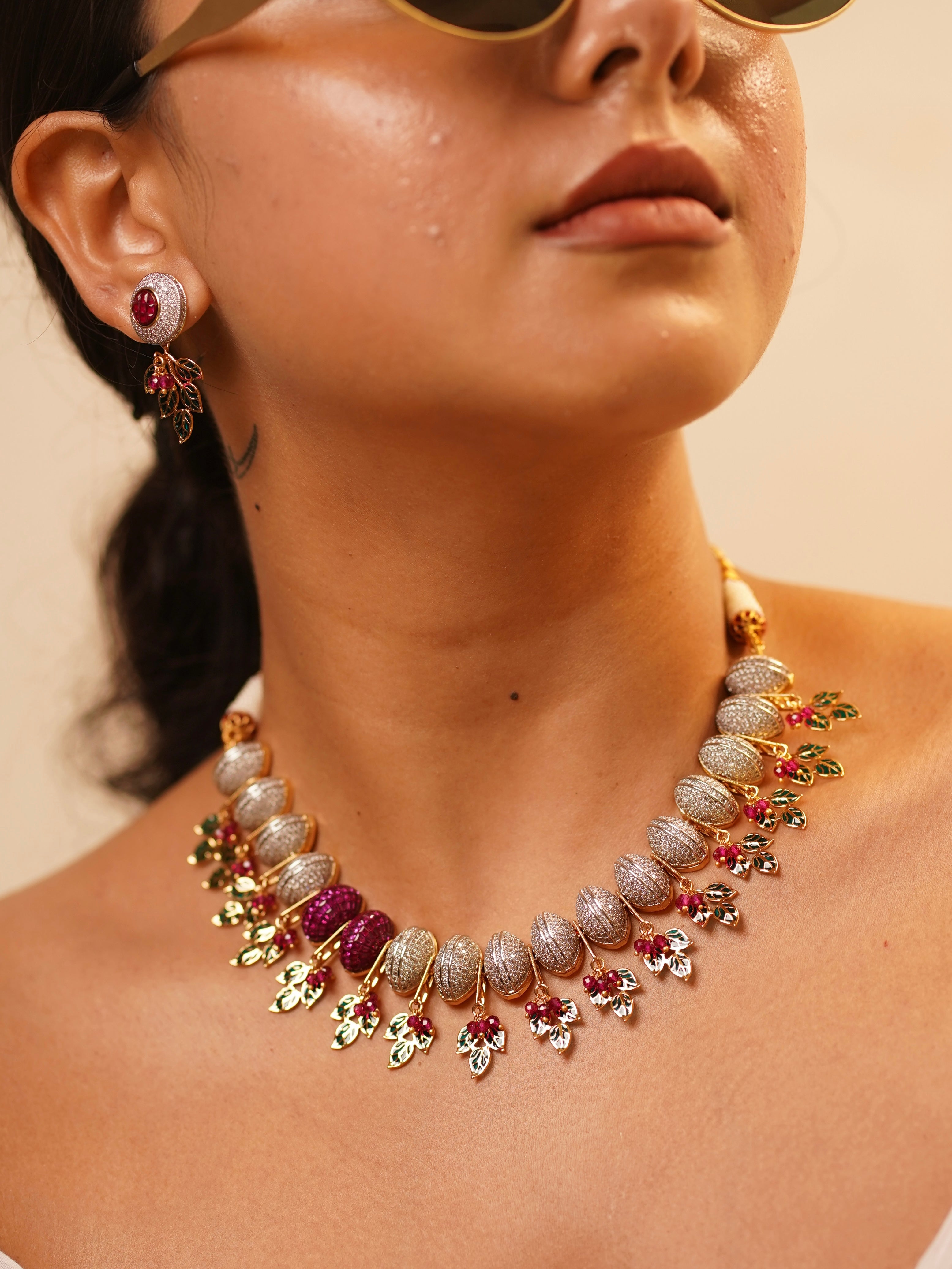 Side view of bridal necklace set featuring diamonds, rubies, and intricate work