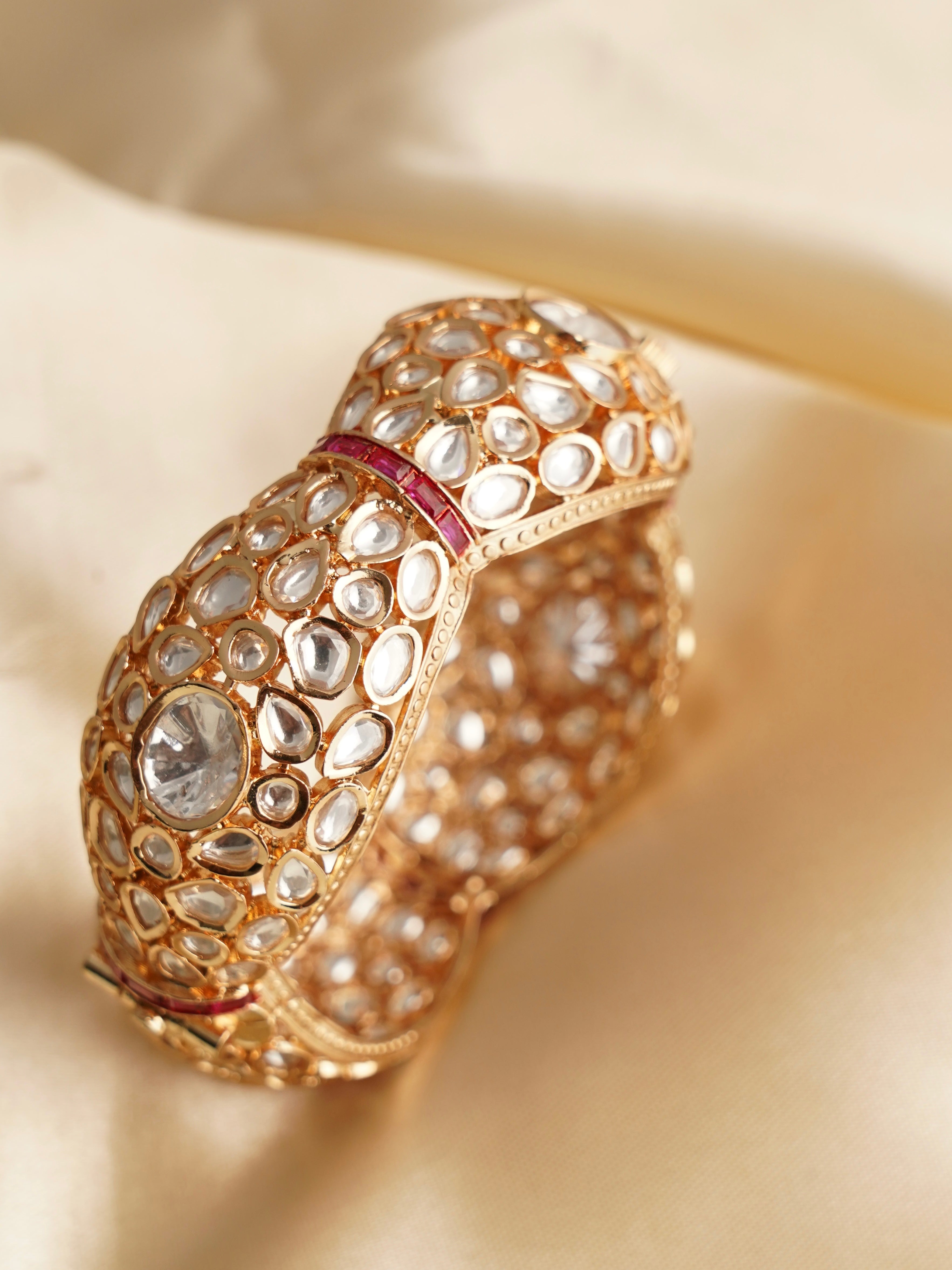 Close-up of polki kundan kada with traditional gold detailing and openable construction