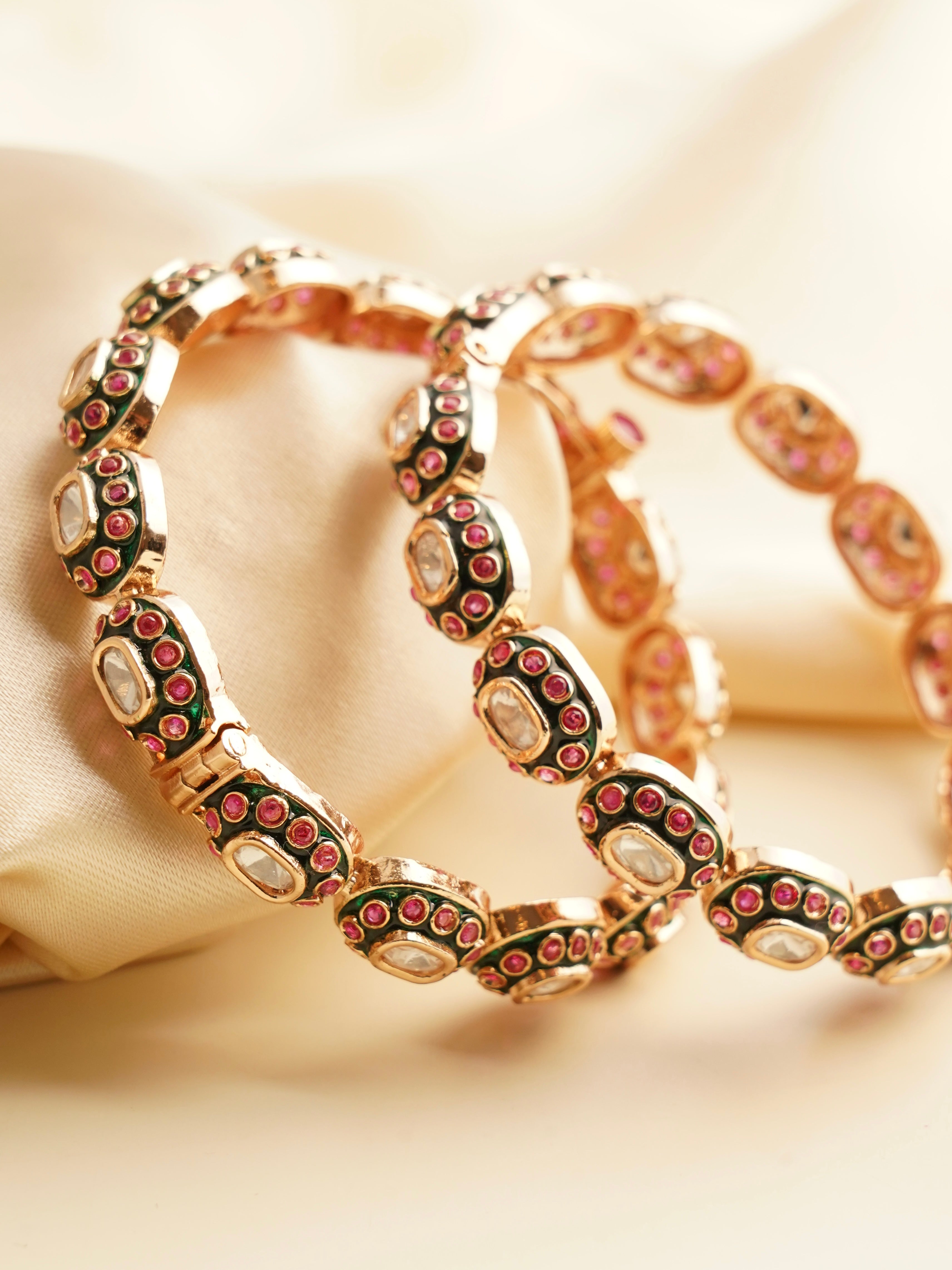 Close-up of openable bangles with rich antique-style detailing and finish