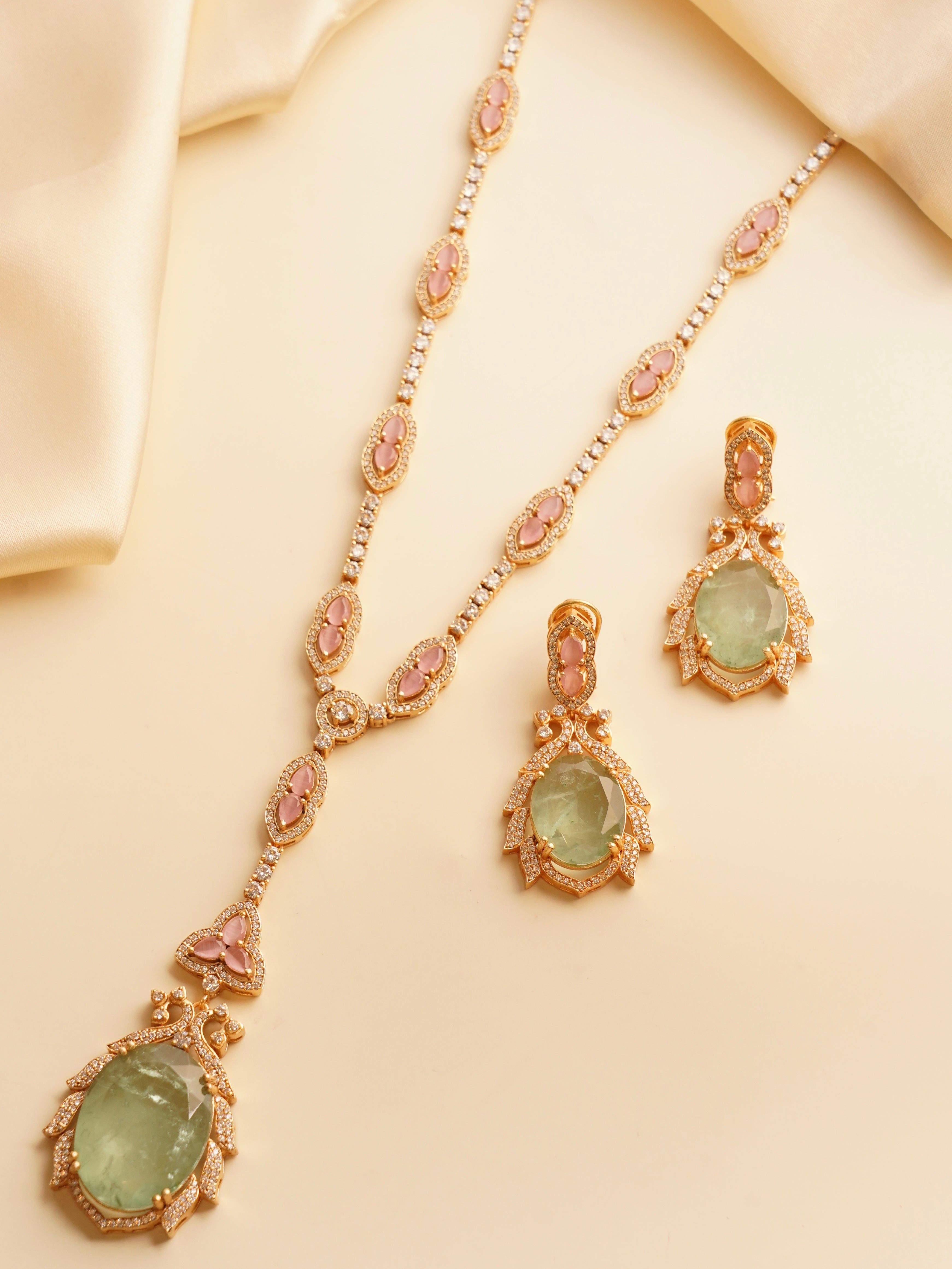 Front-facing view of full noorie necklace set with earrings and bold red accents