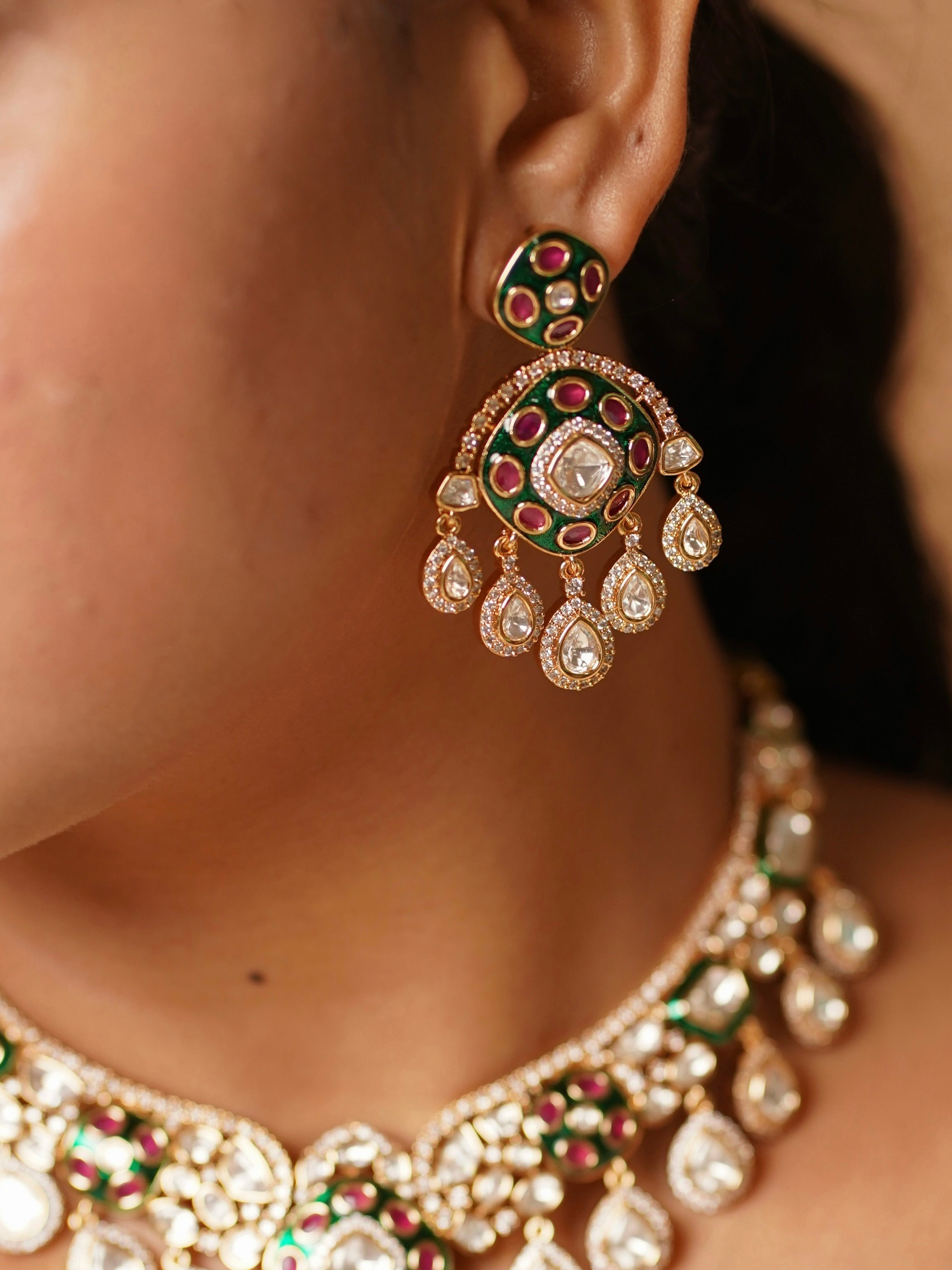 Earring back detail from kundan meenakari set with pushback closure visible