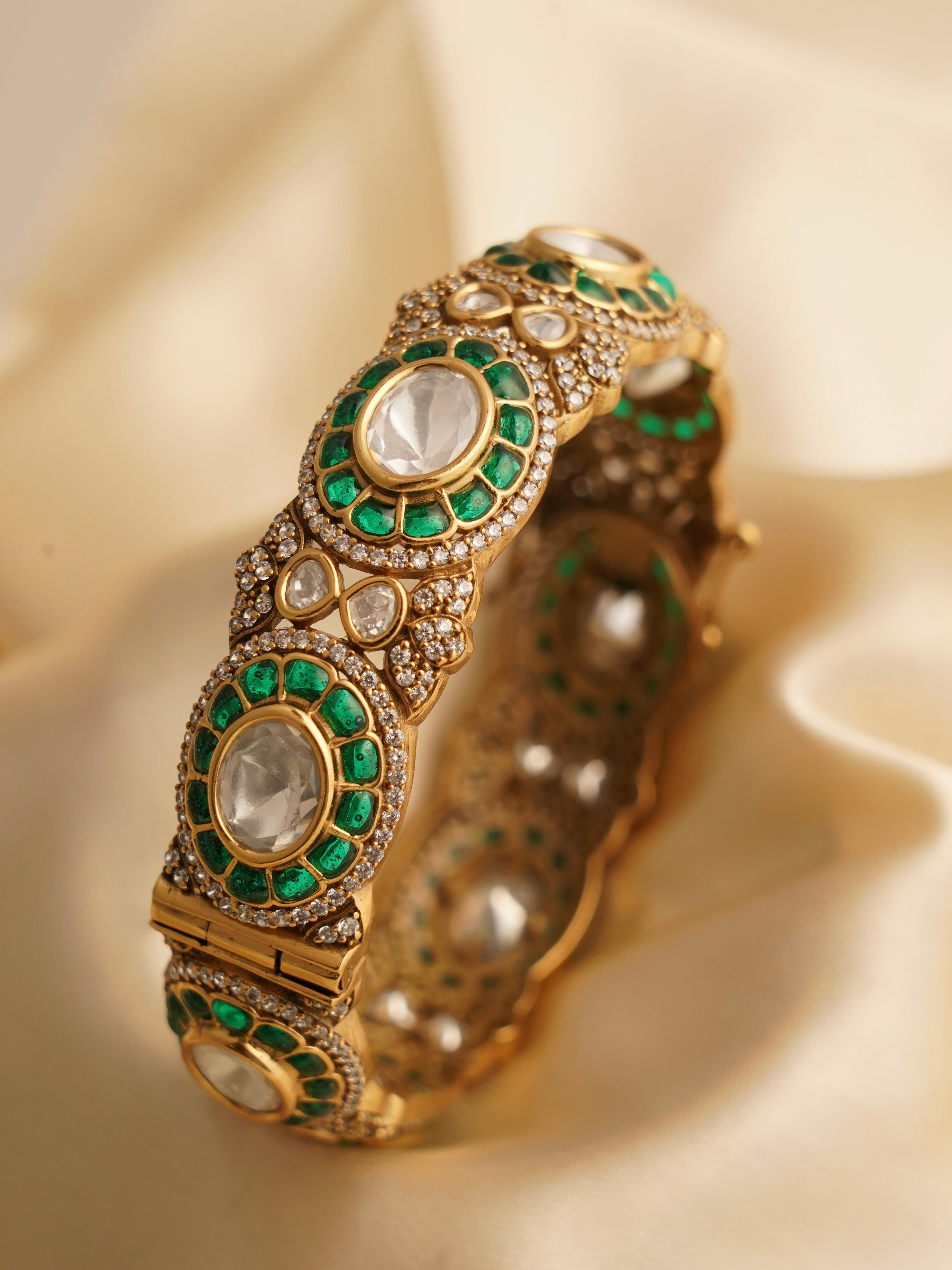 Close-up of red ruby bangle showcasing smooth inner band and gem placement