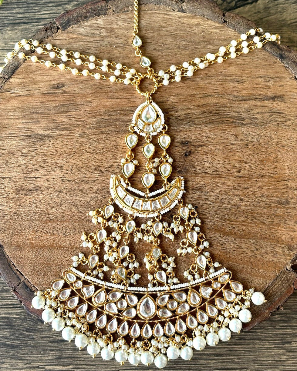 Polki kundan matha patti with floral motifs and central drop, front view
