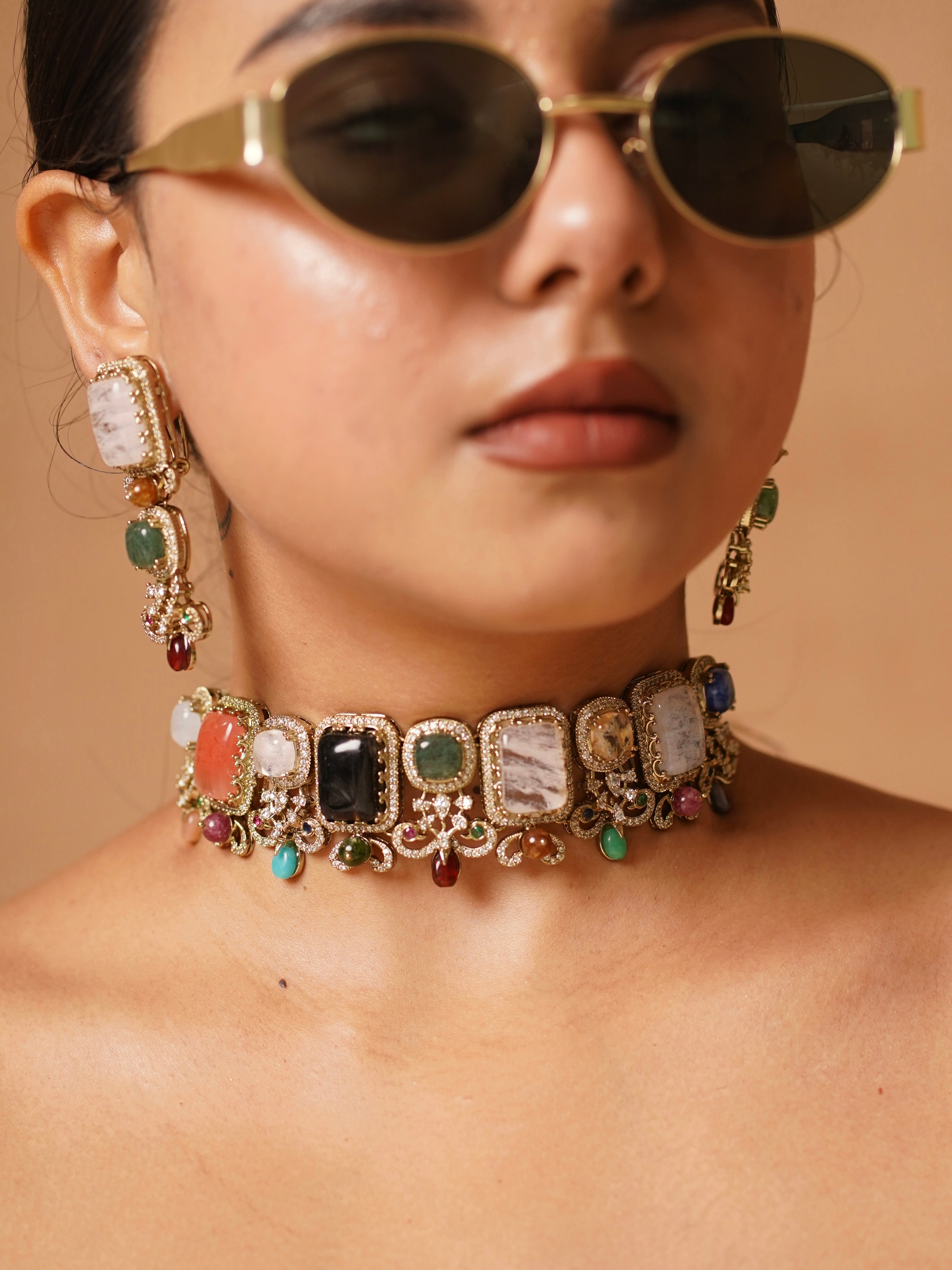 Side view of navrasa choker with gemstone arrangement and gold base