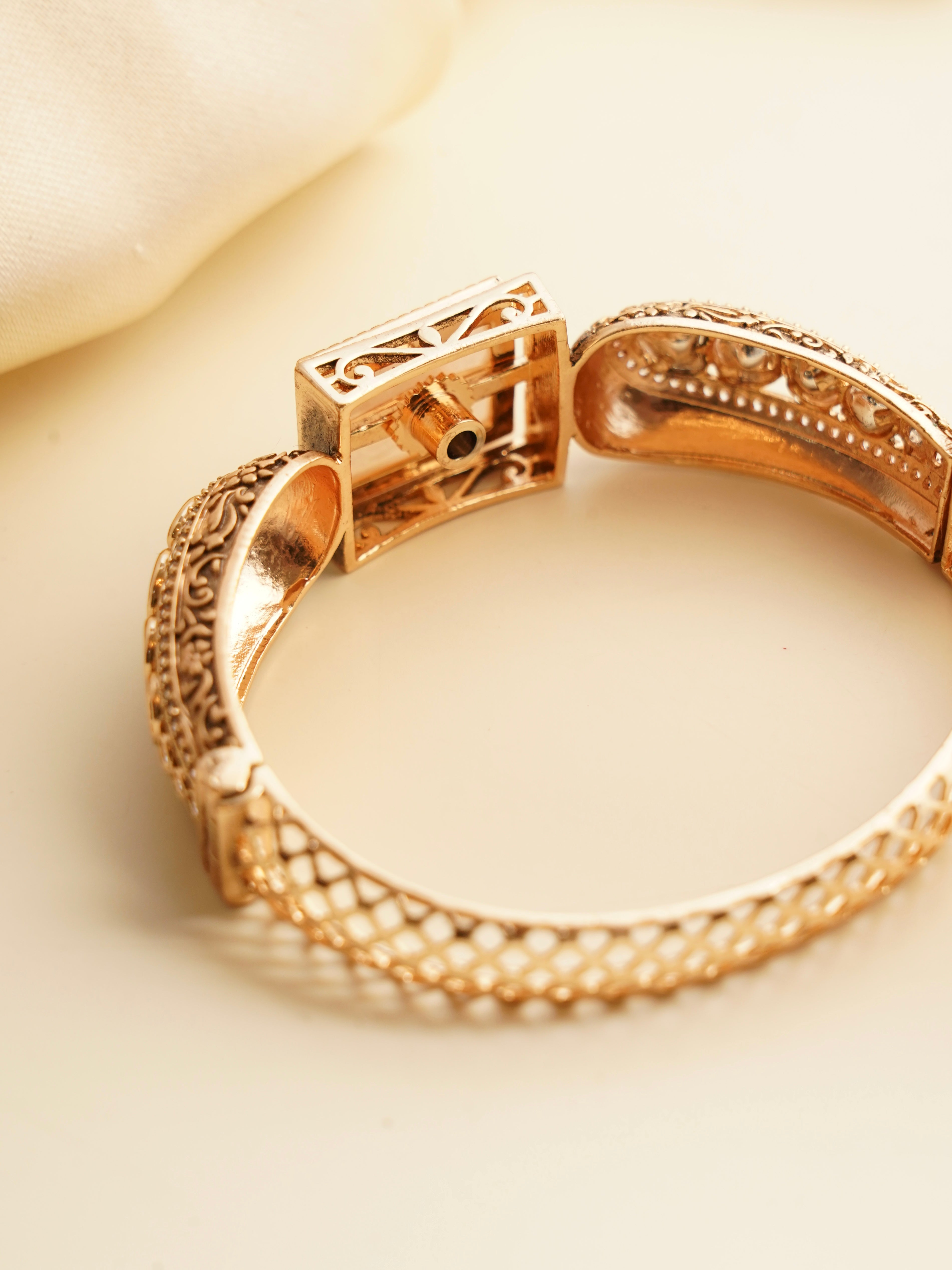 Close-up of vintage-style bracelet showing tile details and clasp mechanism