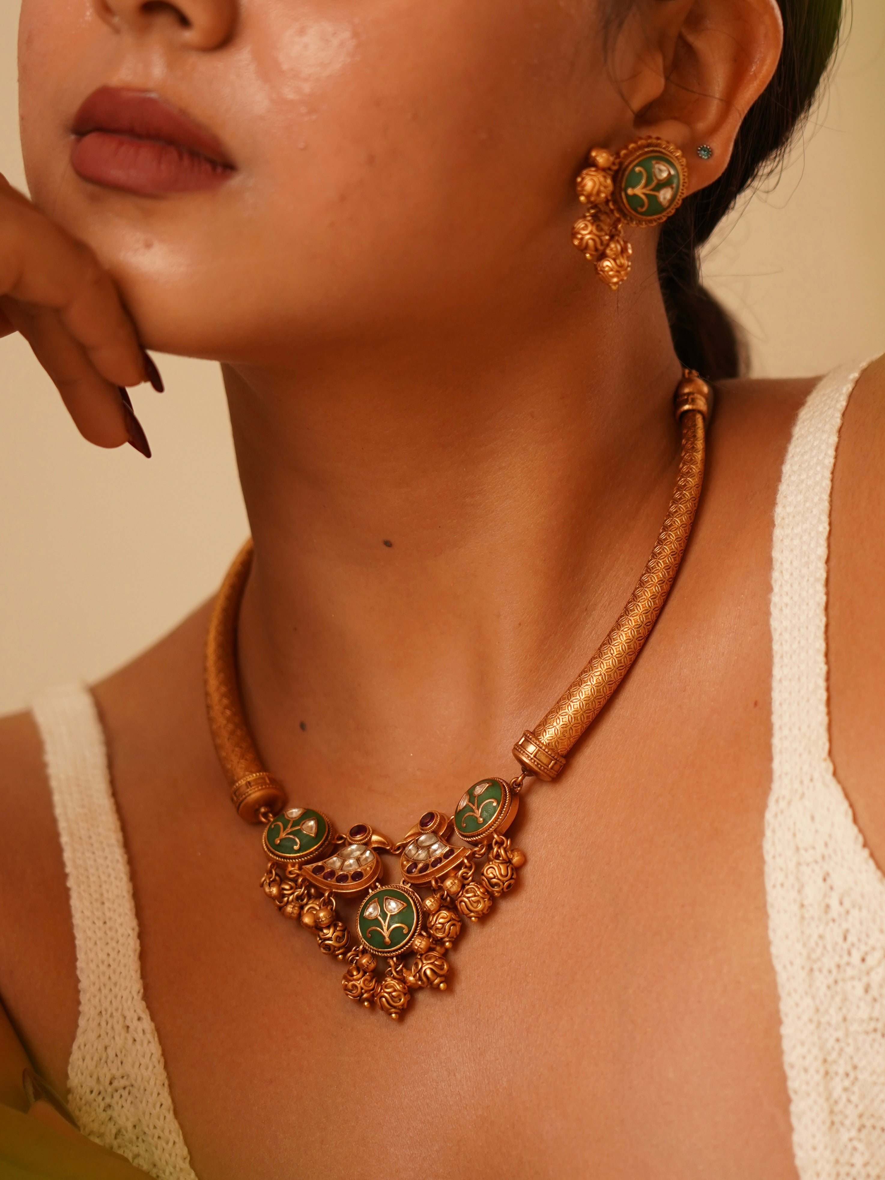 Hasli-style kundan necklace with meenakari enamel and ornate temple motifs