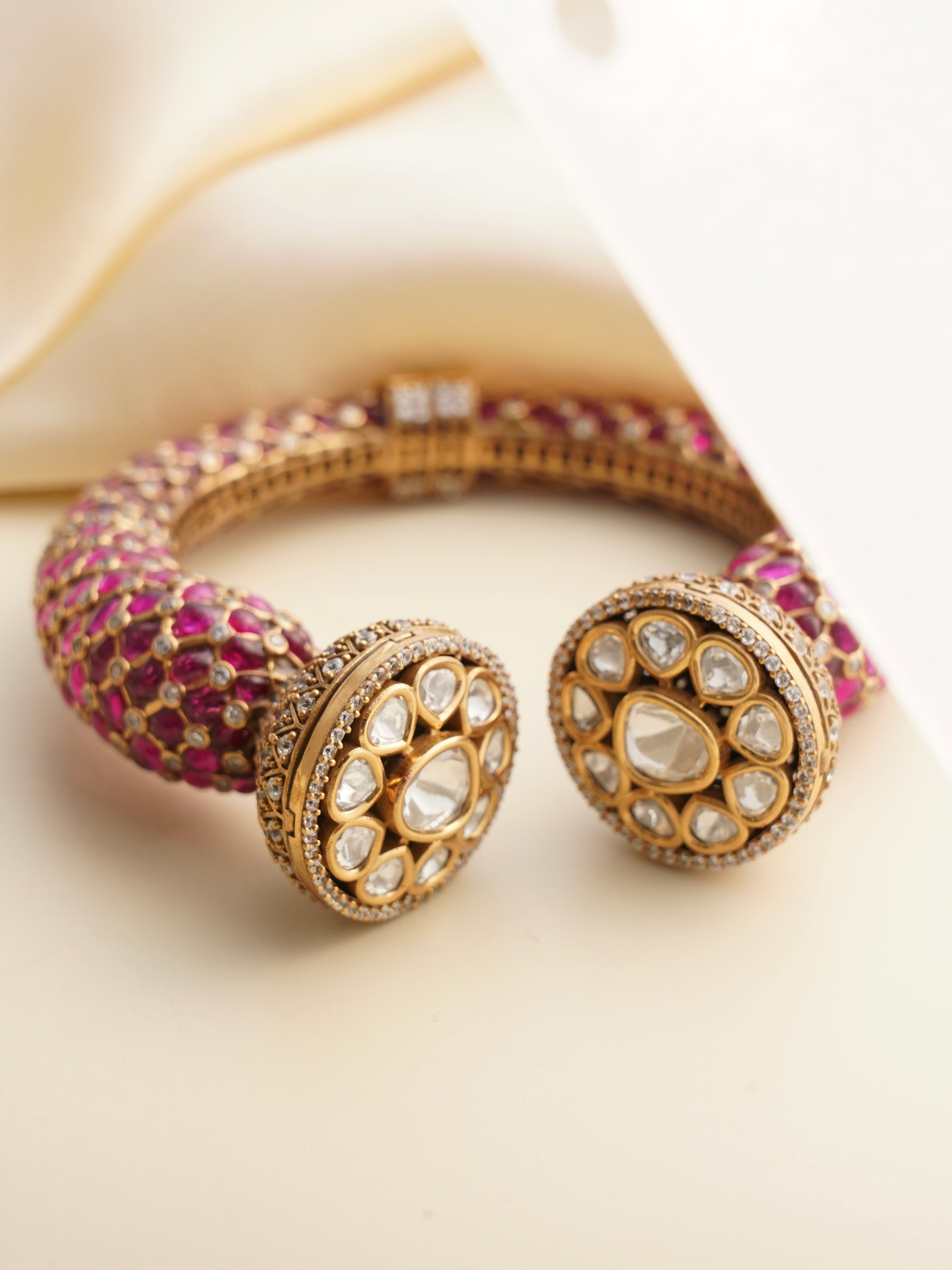 Detailed close-up of enamel kada showcasing polki stones and ornate craftsmanship