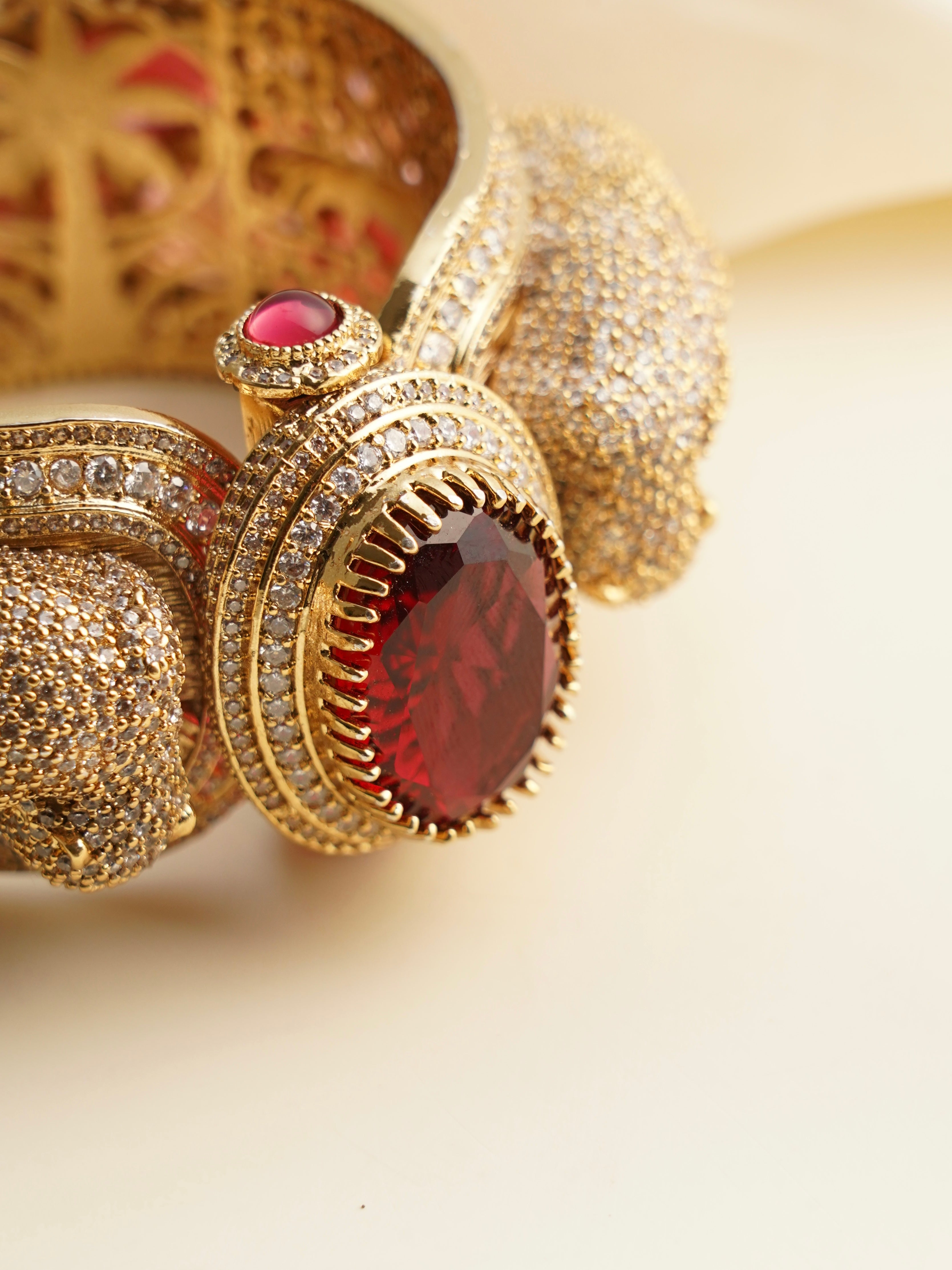 Side angle of panther bangle highlighting detailed feline heads and bold gold silhouette