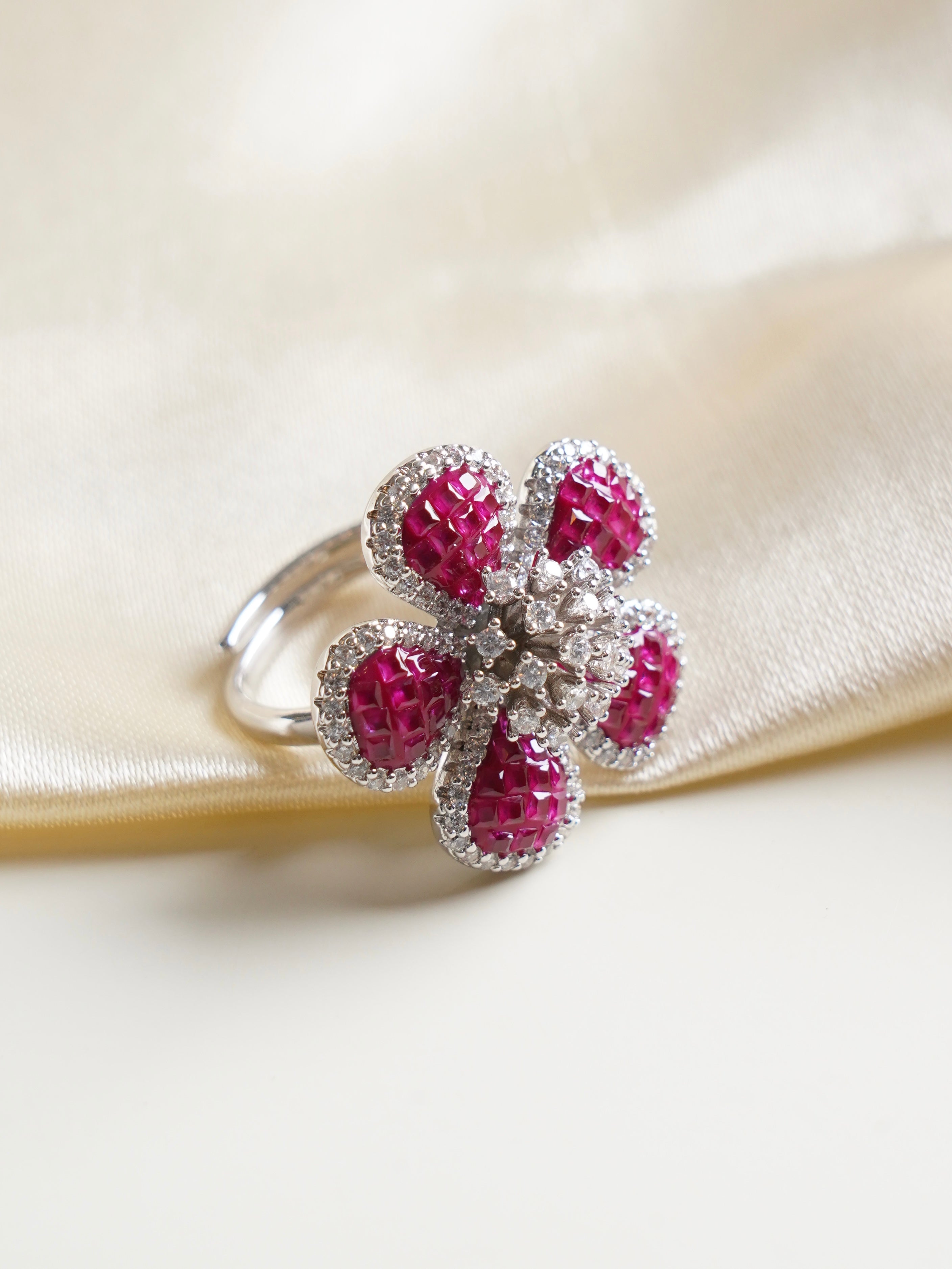 emerald mosaic flower ring featuring baguette stones and crystal outline on adjustable shank